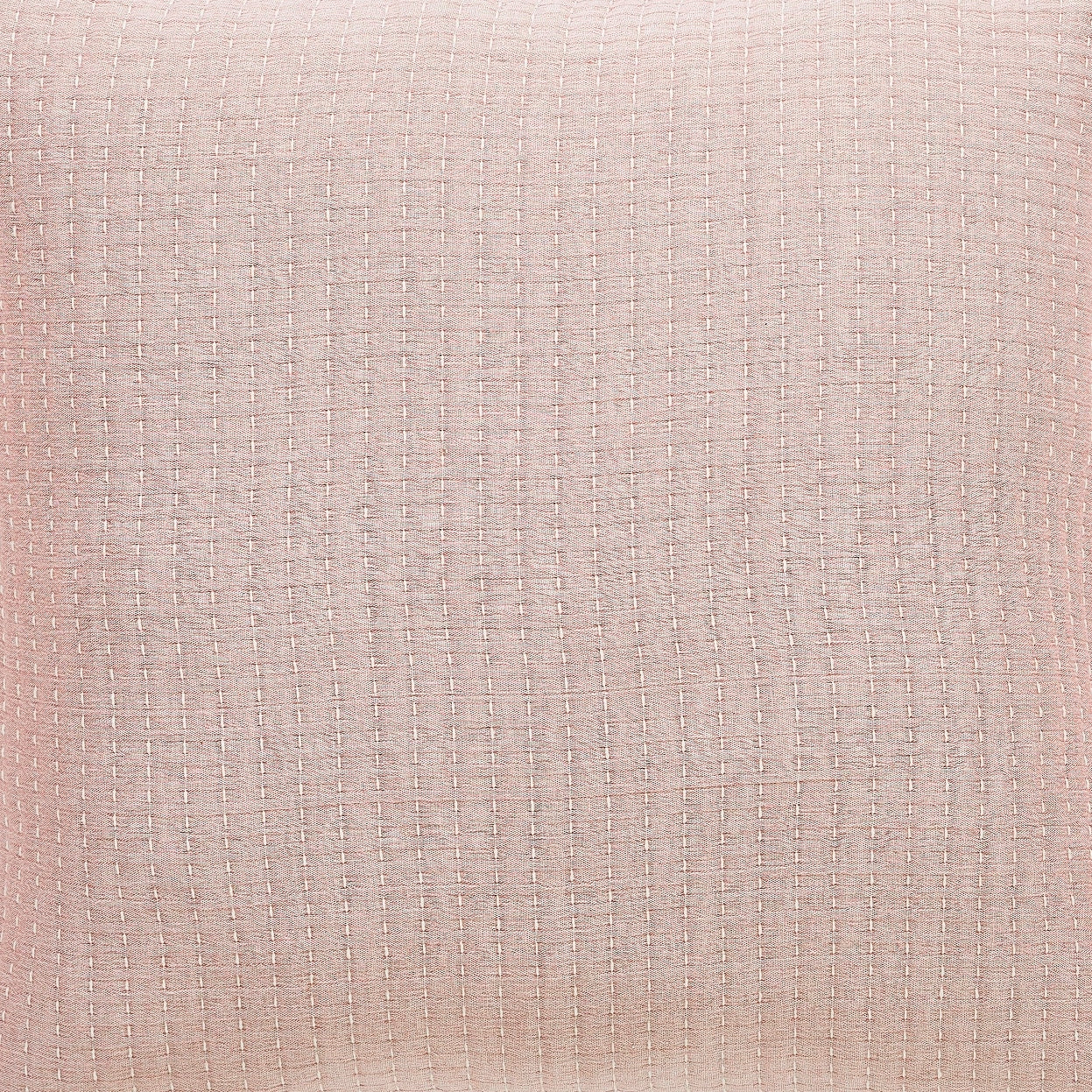 BT-105-9496_2|Close-up of a soft blush pink blanket fabric with subtle grid texture, adding warmth and visual interest to bedroom decor.