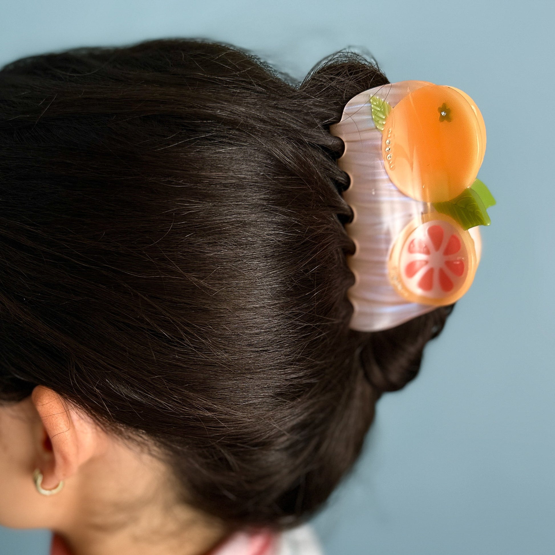 California pomelos orange juicy citrus hair claw clip from Centinelle. Handmade on cellulose acetate, with splice technique, exquisite miniature details and crystals, that are tied directly to its value and make them unique and special. 