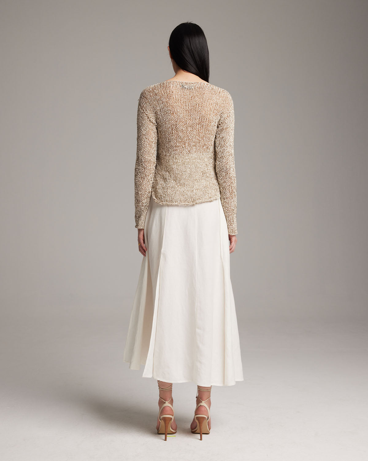 Model wearing a Marble Loose Knit Midlength Crop Sweater, back view