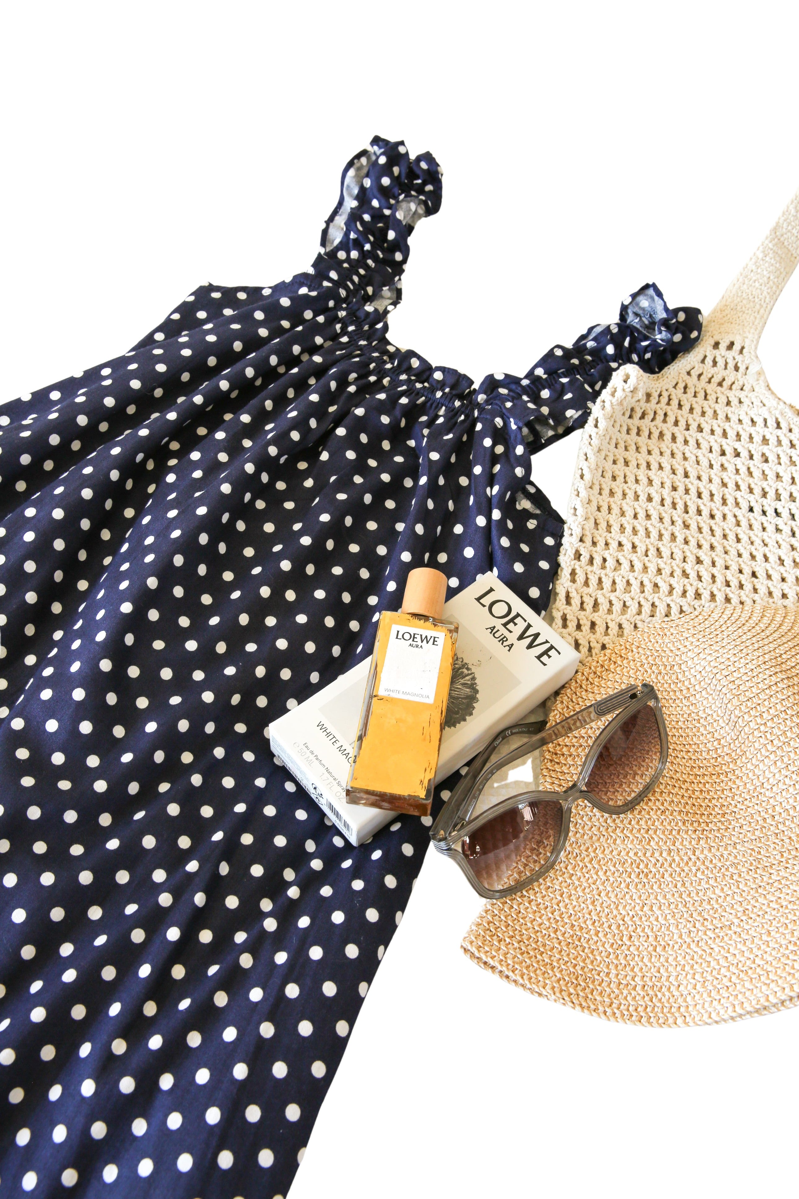 Mila Navy front view — slim shoulder strap cotton mini dress in navy polka dot print