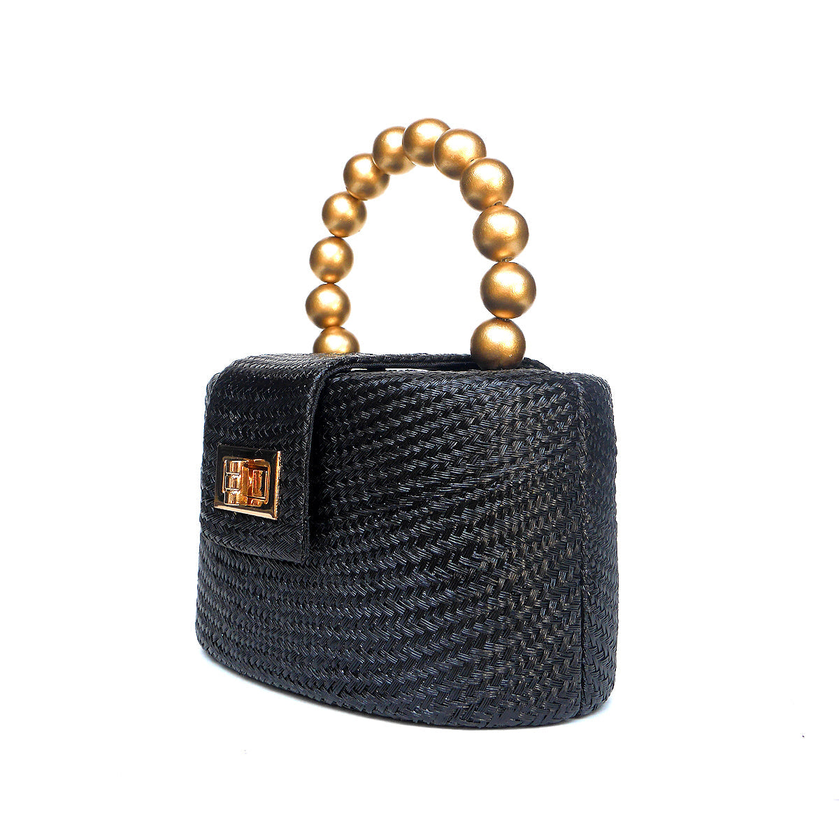 A black woven straw handbag with a cylindrical body, a gold-tone metal logo plaque on the front flap, and a top handle made of large gold-colored beads, shown on a plain white background.