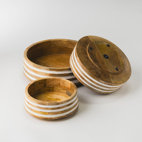Top-down view of 3 nested mango wood serving bowls showing natural wood grain and white stripe accents.