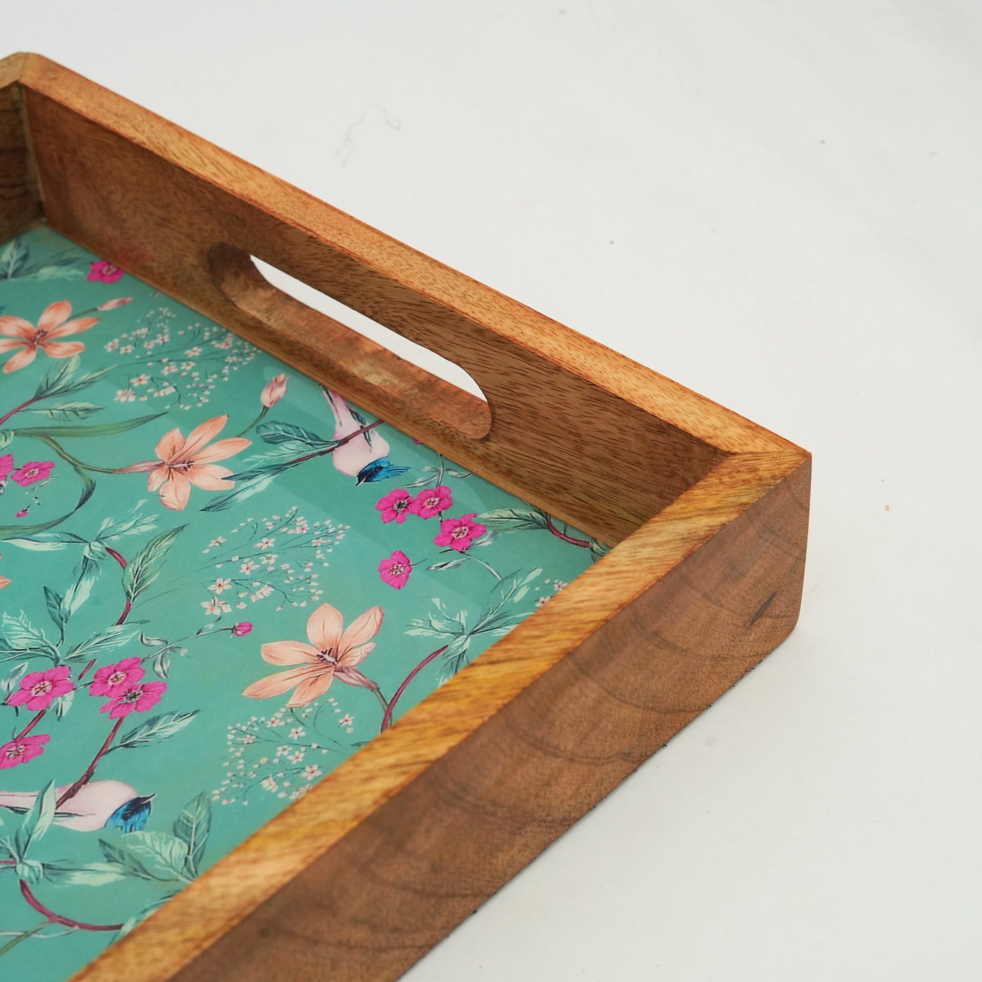 Aqua Flora inlay tray used as a chic coffee table organizer for candles and small books.