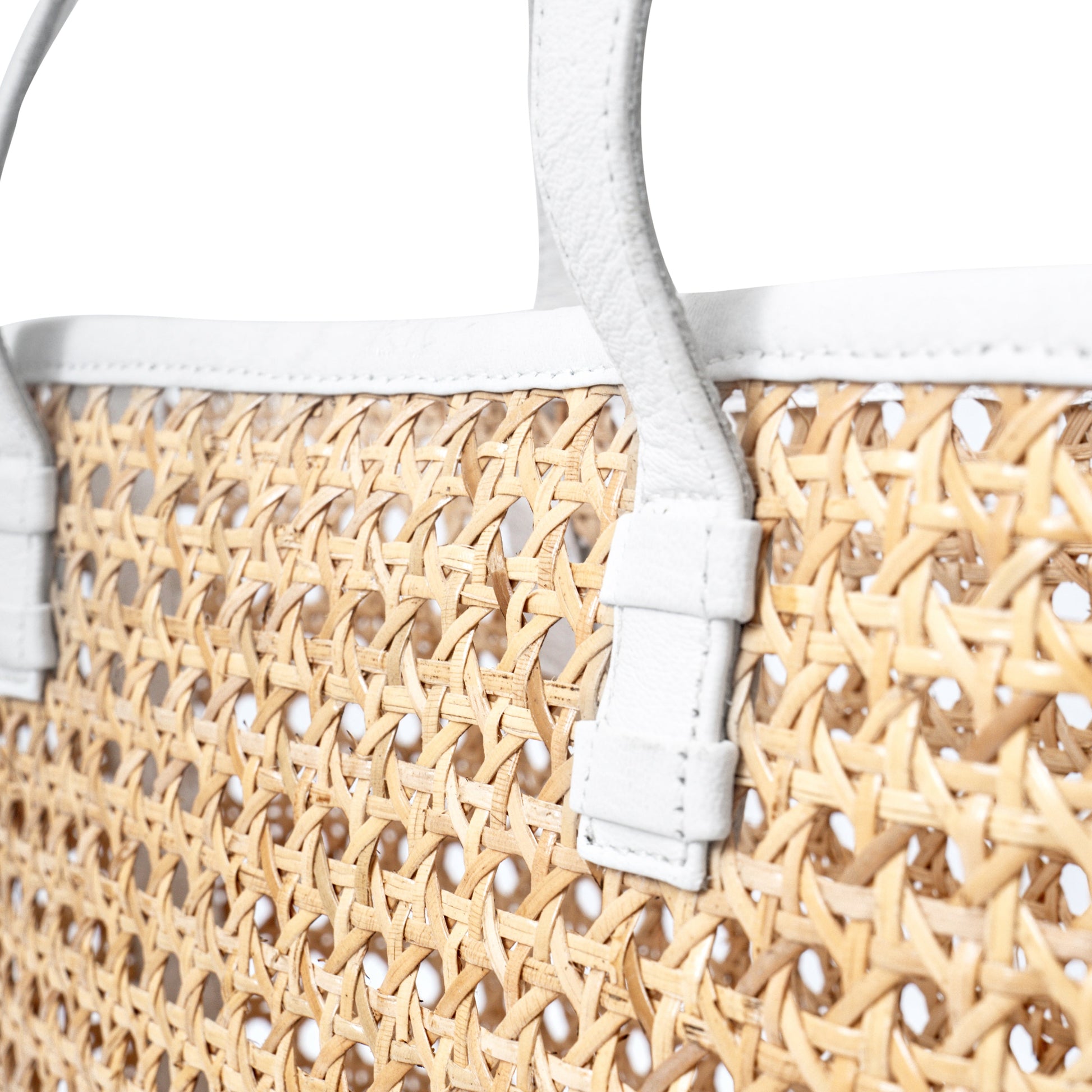 Detail view rattan cane white leather trim open weave basket tote shoulder market shopper handbag
