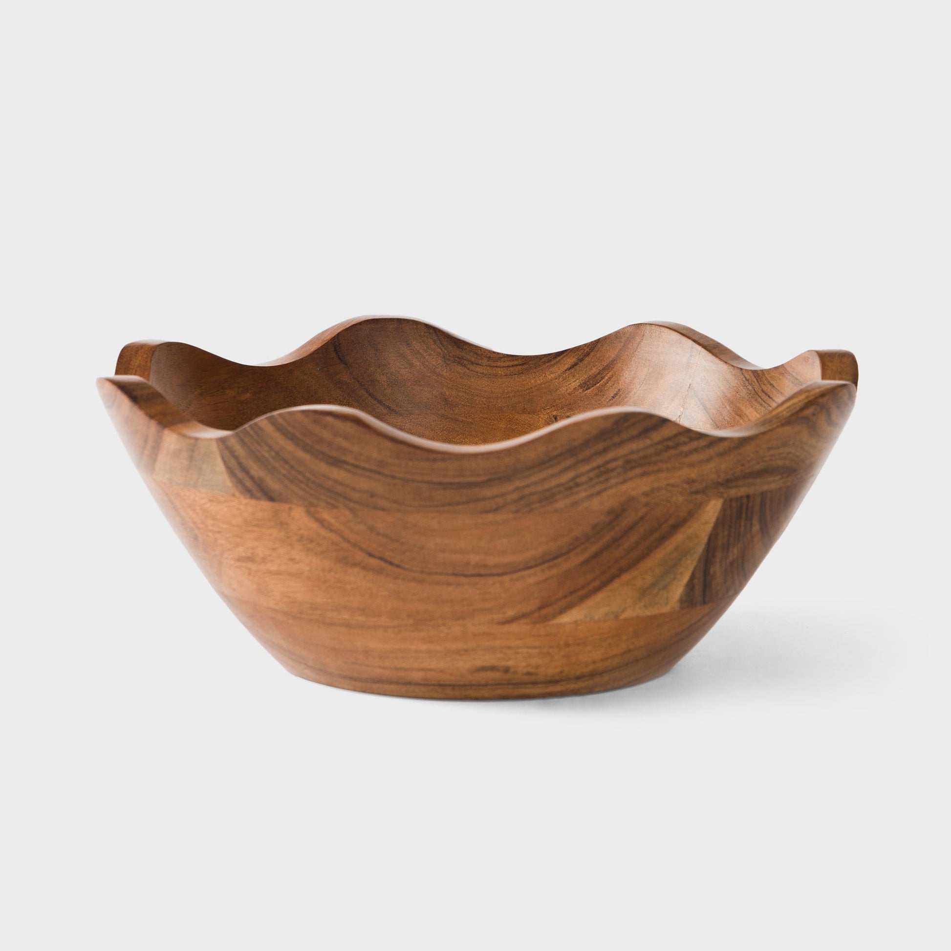 Acacia wood scalloped serving bowl with natural finish