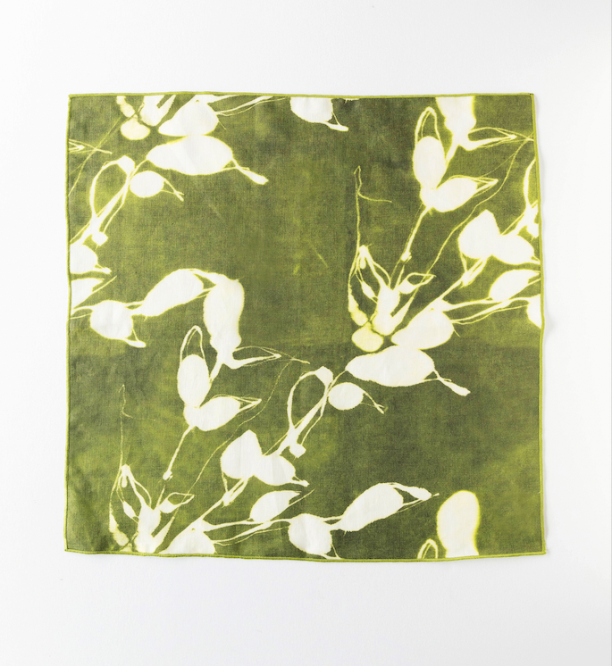 Porto Print Olive linen dinner napkin styled on place setting - Goldie Home