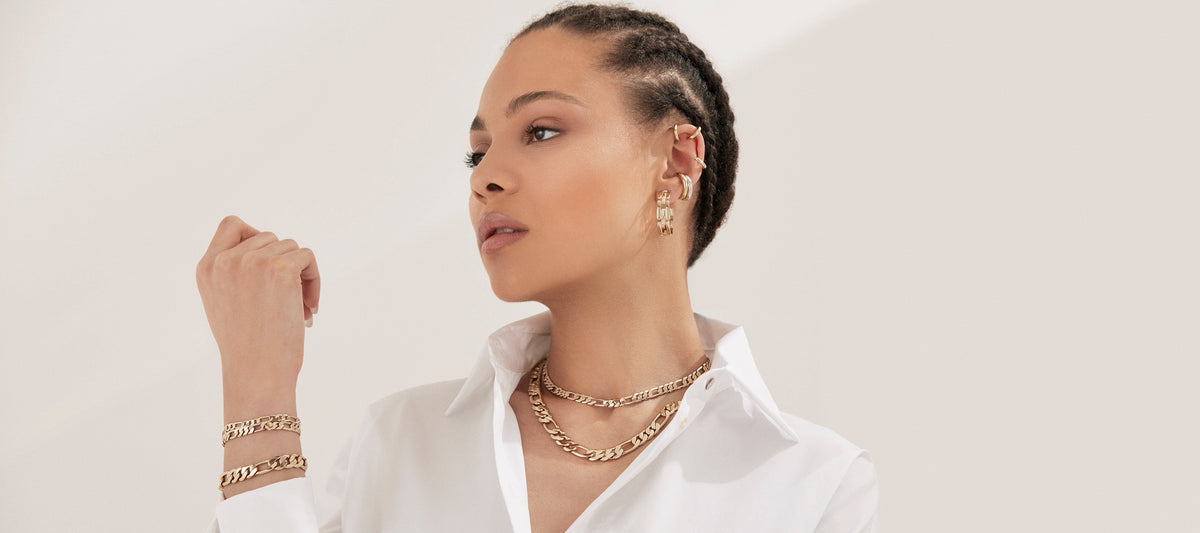 Woman wearing gold Baby Axel Chain Necklace, stylish and trendy jewelry look