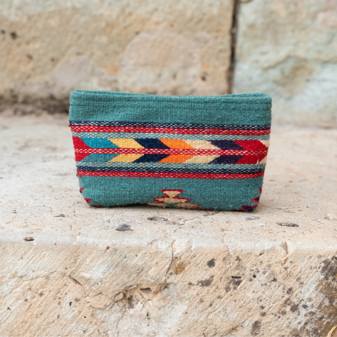 Handwoven pouch with abstract Zapotec arrow design in bold colors featuring internal pocket; perfect for makeup, wallet, or daily essentials.