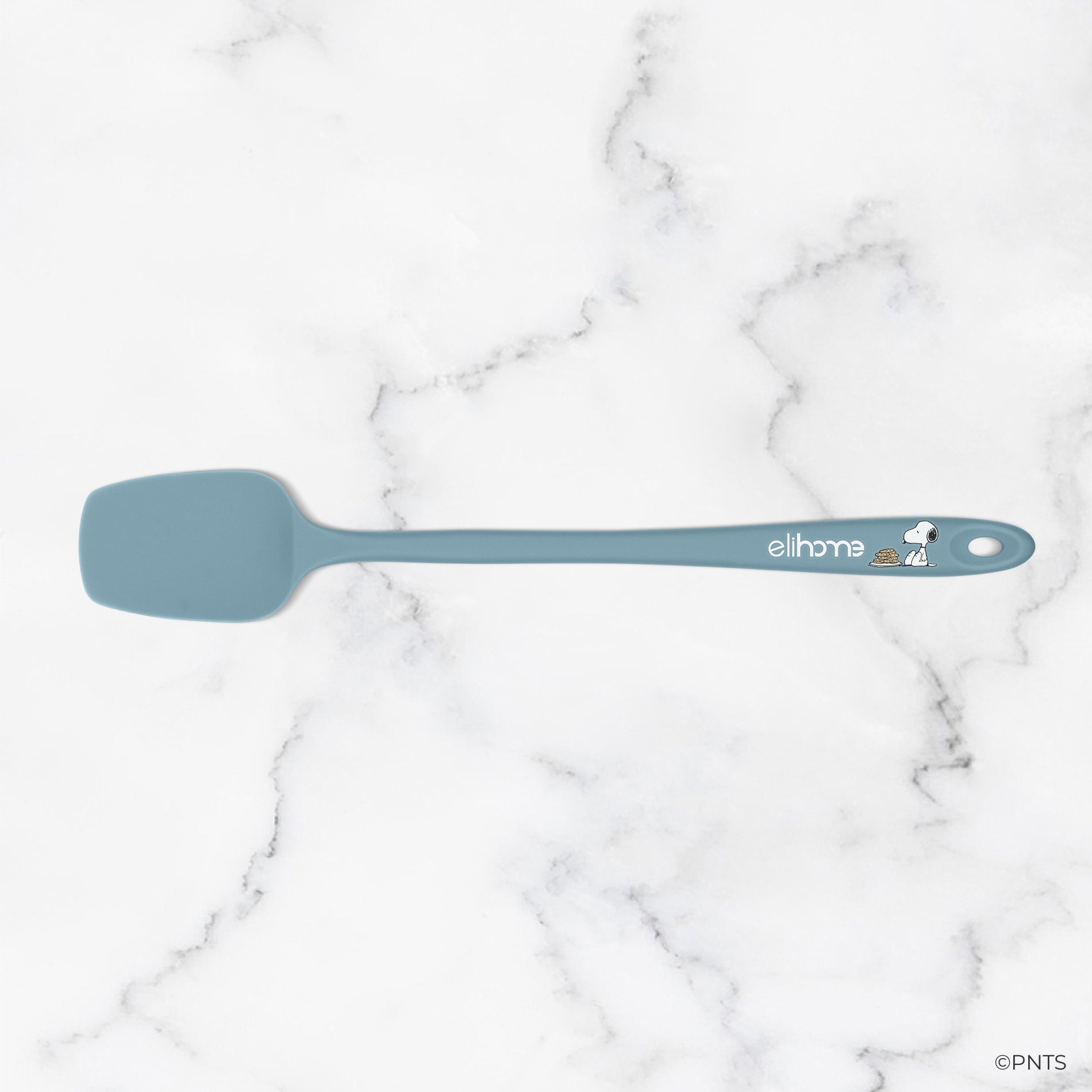 Blue spatula on a marble surface with 'elihome' branding.