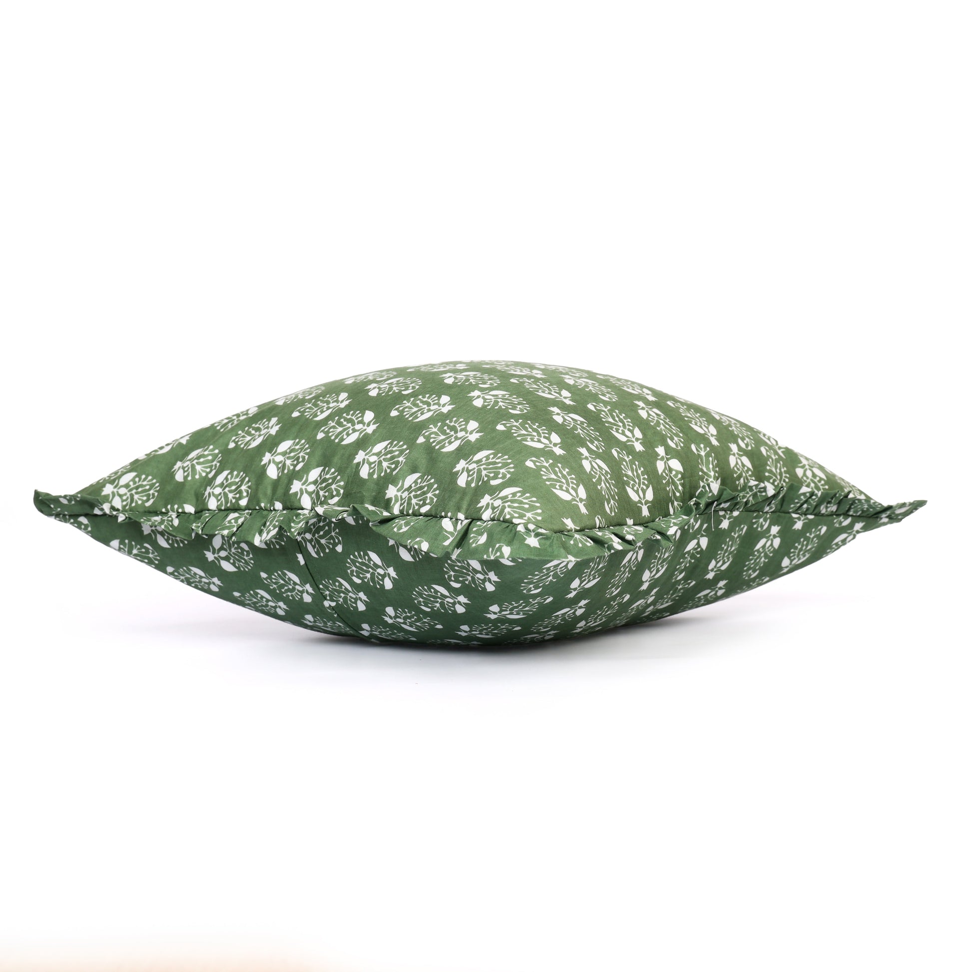 Green block-printed pillow shown flat with ruffle detail