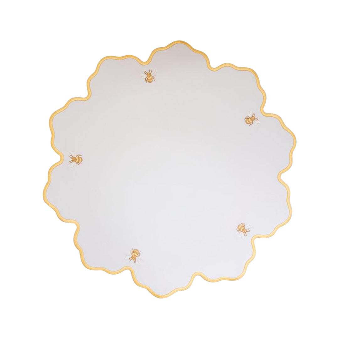 Bumble bee impermeable placemat with hand-stitched bee embroidery and yellow wavy border by Talah Home