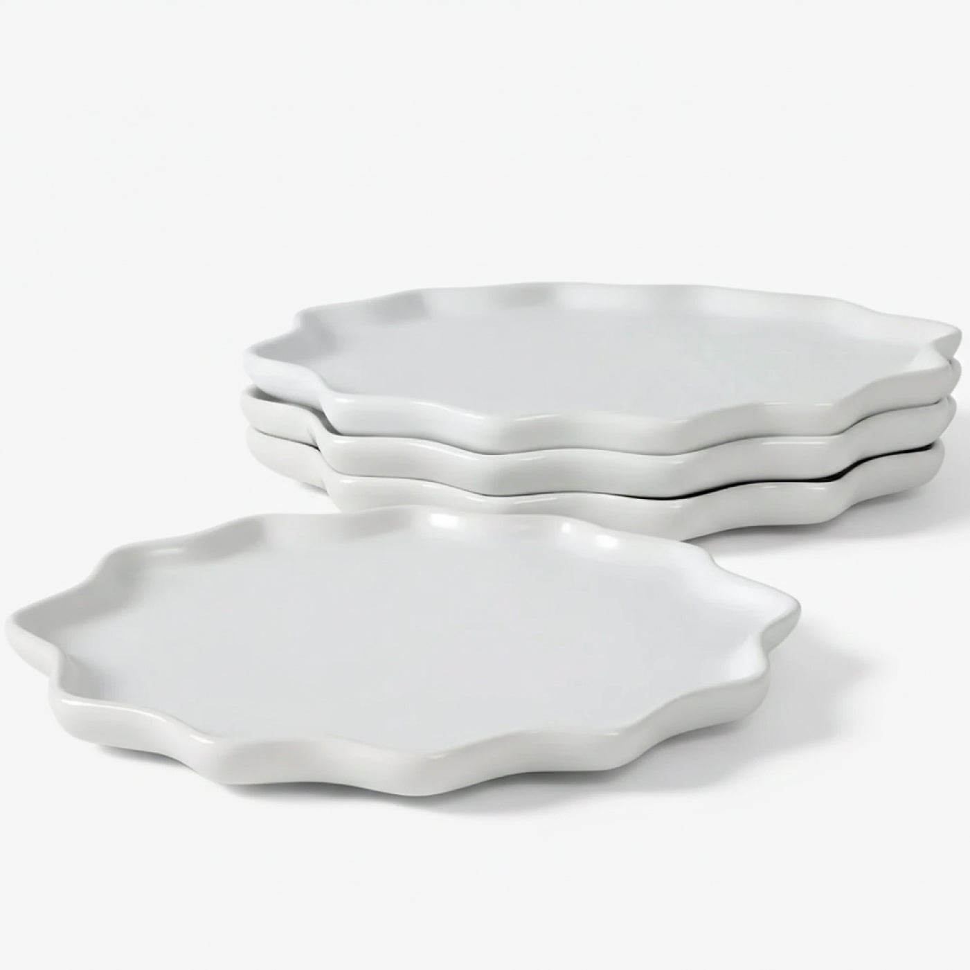 A 4-piece set of BosilunLife Bring Nature Inside dinner plates in a crisp white gloss finish. Crafted from recycled eco-clay, the plates feature a unique, organic Forest Star silhouette with a scalloped, wavy rim. The set is shown with three plates neatly stacked in the background and one plate in the foreground against a clean white background, highlighting a minimalist and sustainable dining aesthetic.
