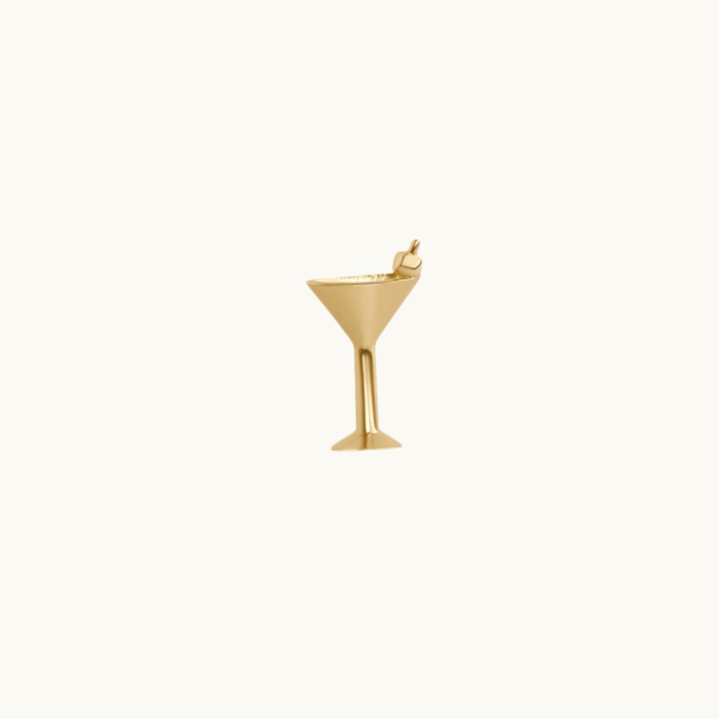 A 14K yellow gold martini stud earring with a tiny olive detail, designed to look like a martini glass.