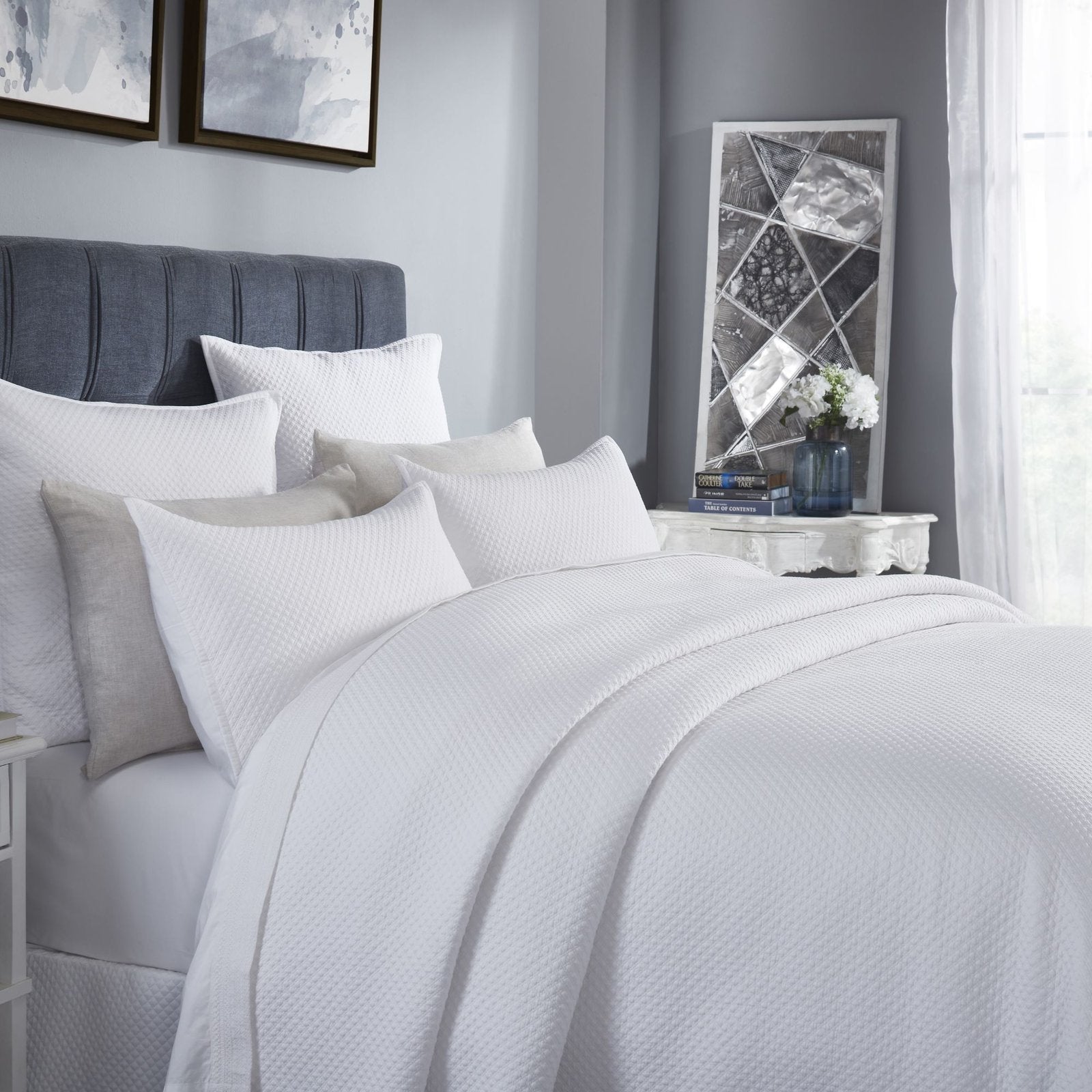 CL-200-11096_3|Detailed view of a luxurious white textured coverlet, showcasing its elegant pattern and clean, modern style.