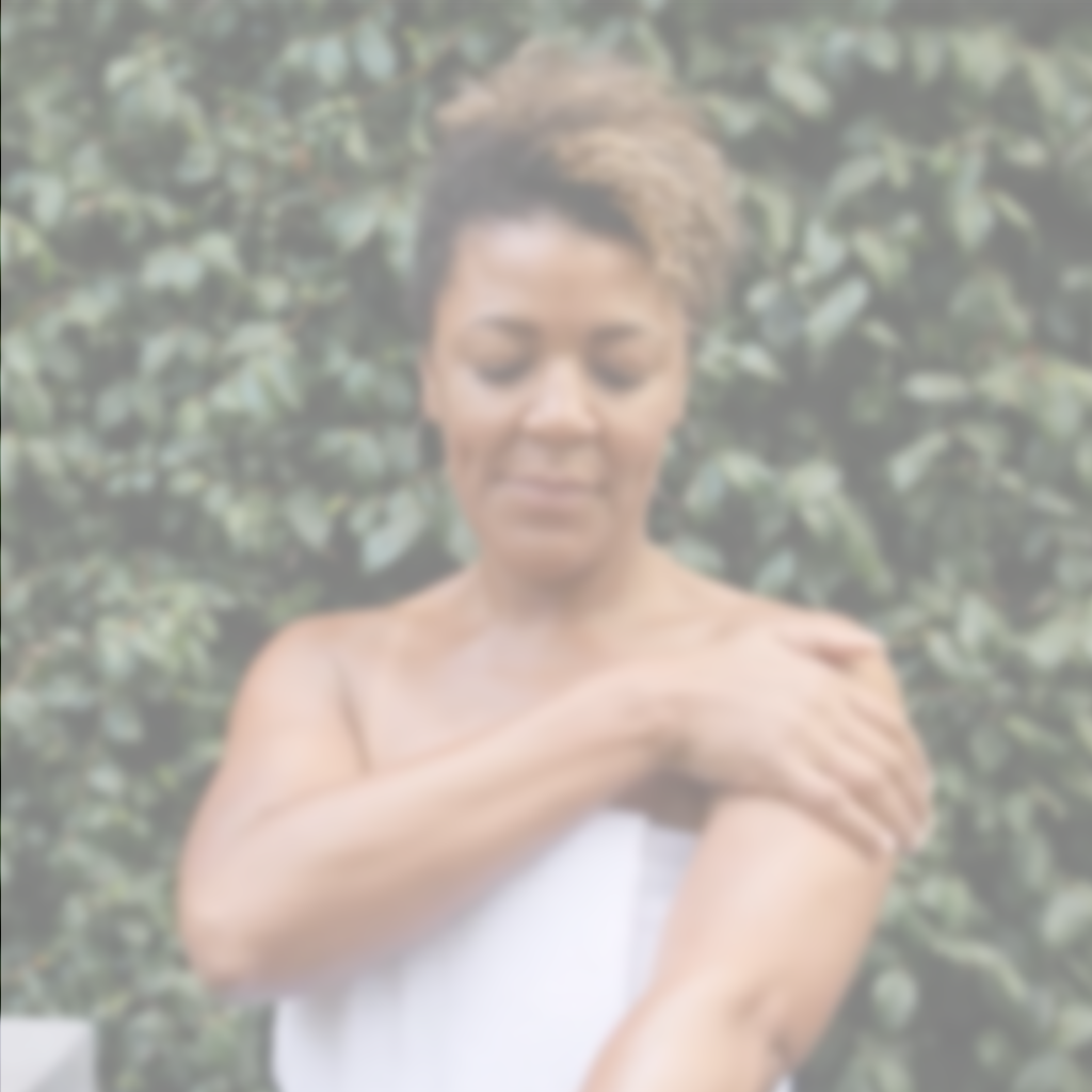 Video demonstration of applying Annmarie Coconut Body Oil during a natural body care routine.