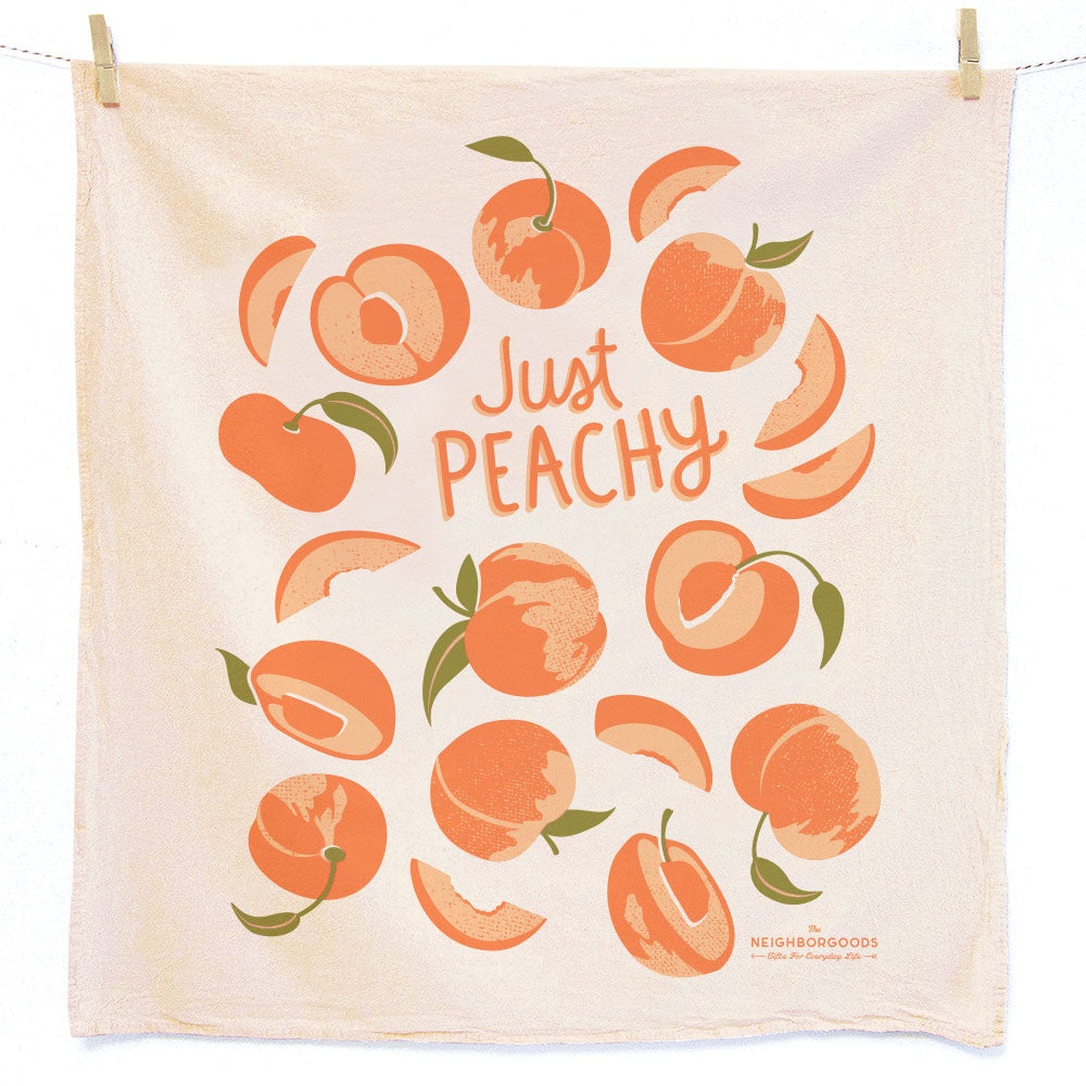Reusable Swedish sponge cloth with peaches design, featuring the phrase "Just peachy"