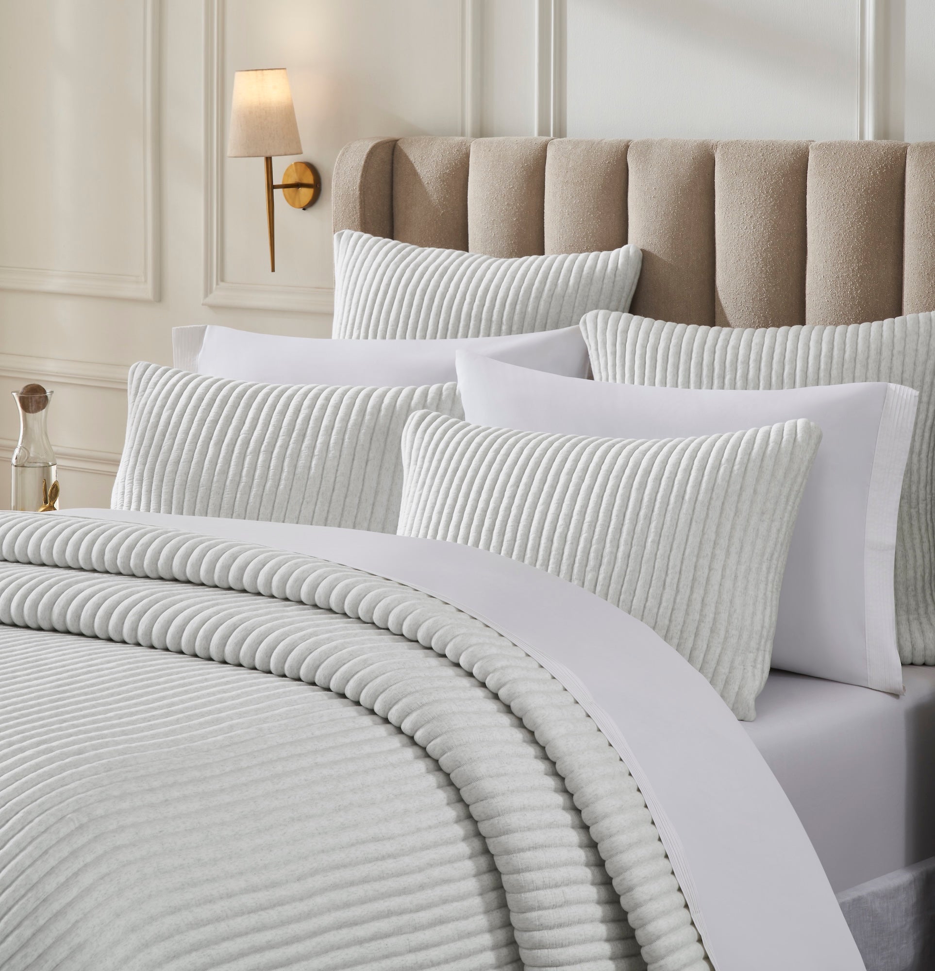 QT-374-9496_3|Detailed view of a light grey ribbed quilt and coordinating pillow shams, showcasing soft texture for luxurious bedding.