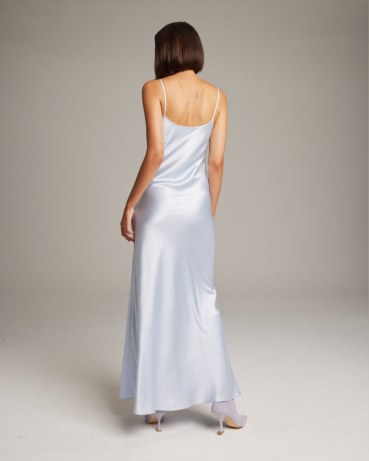 Back view of a light blue Liquid Silk Slipdress with thin straps
