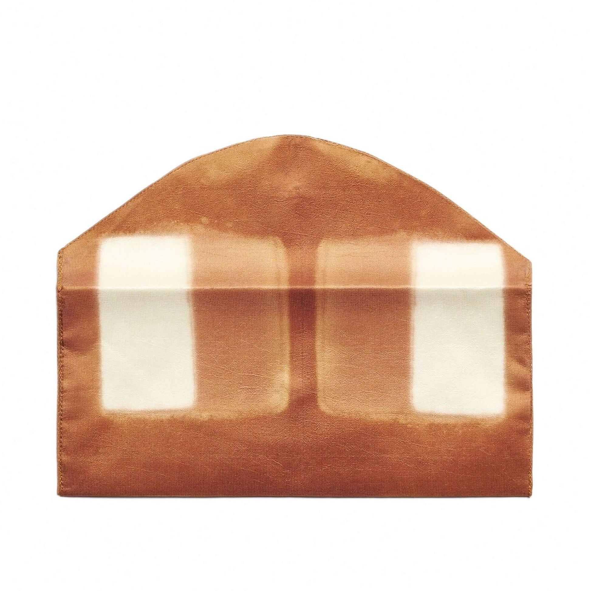 Melo Gold Mulberry Silk Shibori Hand Crafted Envelope Pouch in a rich brown color with an artistic pattern.