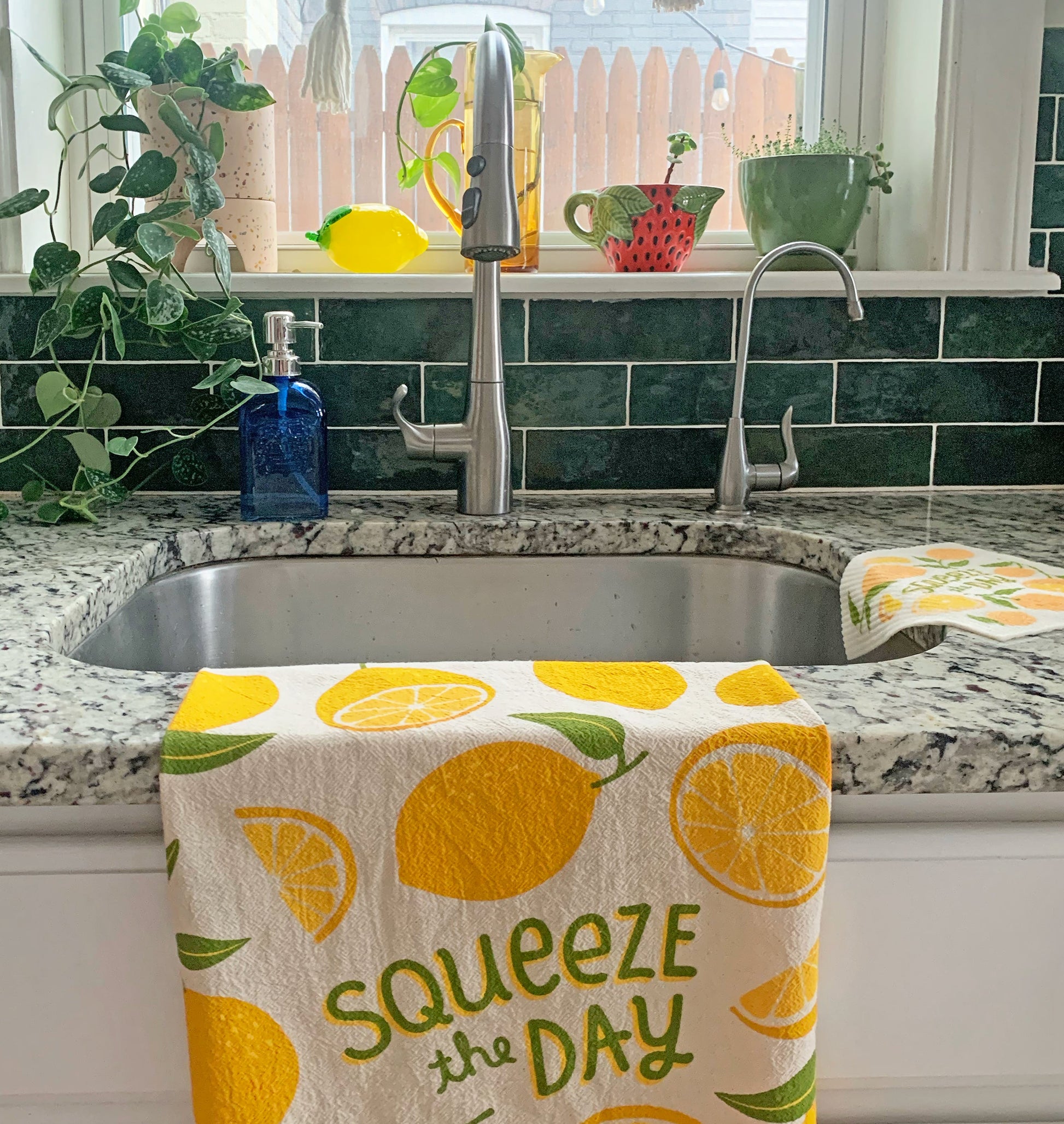 Cotton dish towel with lemons design, featuring the phrase "Squeeze the day"