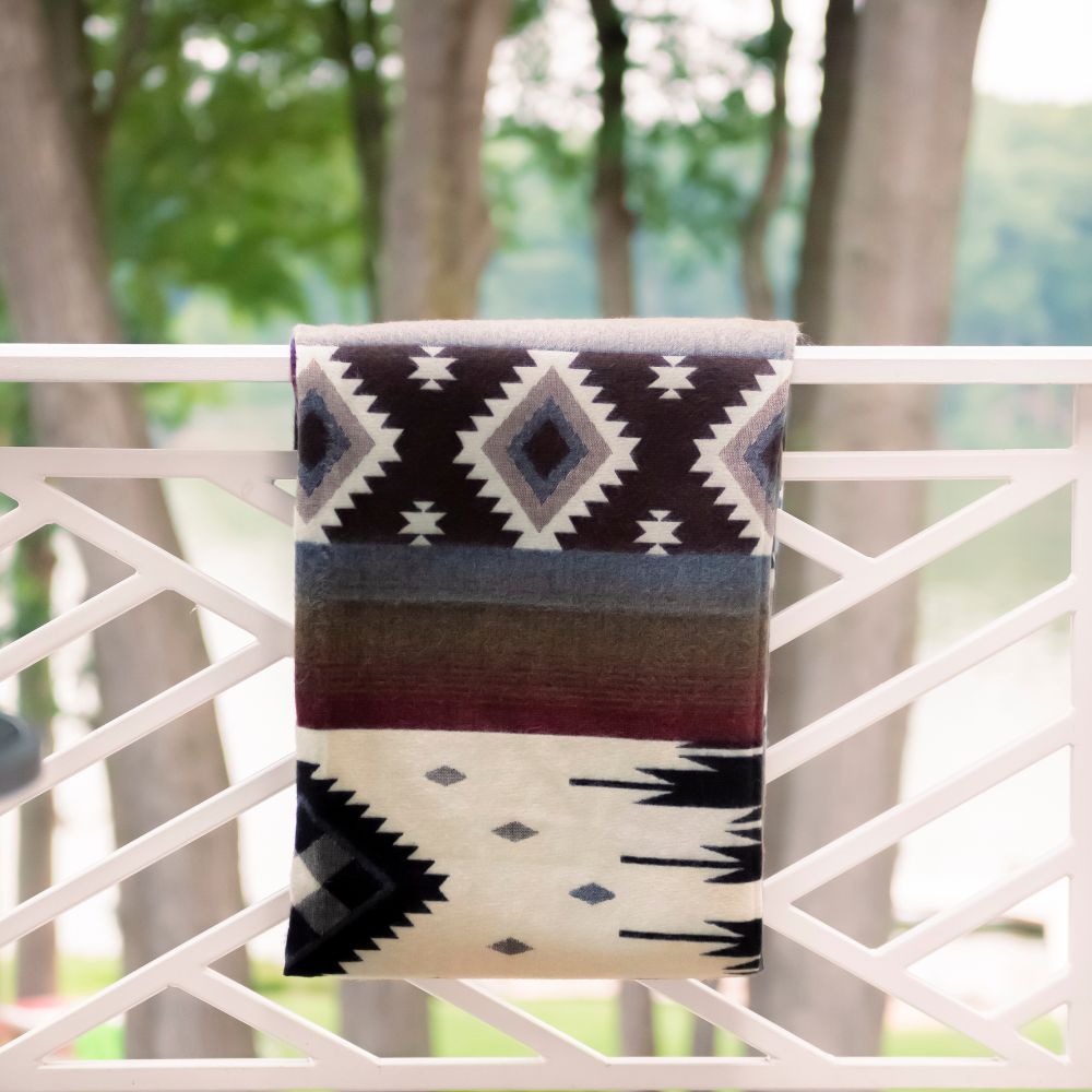 Artisanal black woven throw with white pattern