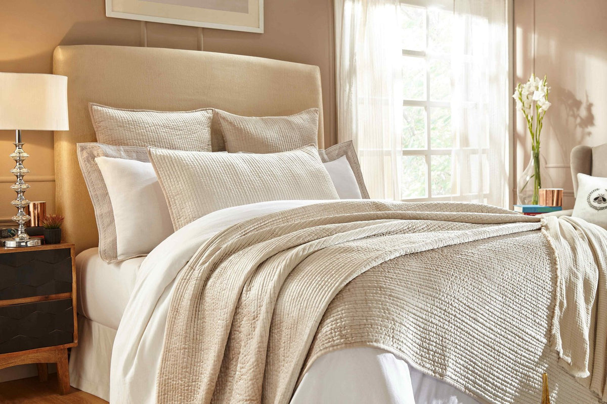 CL-154-9496_3|Peach textured coverlet with subtle vertical stripes and a crushed velvet-like feel, perfect for a cozy bedroom aesthetic.