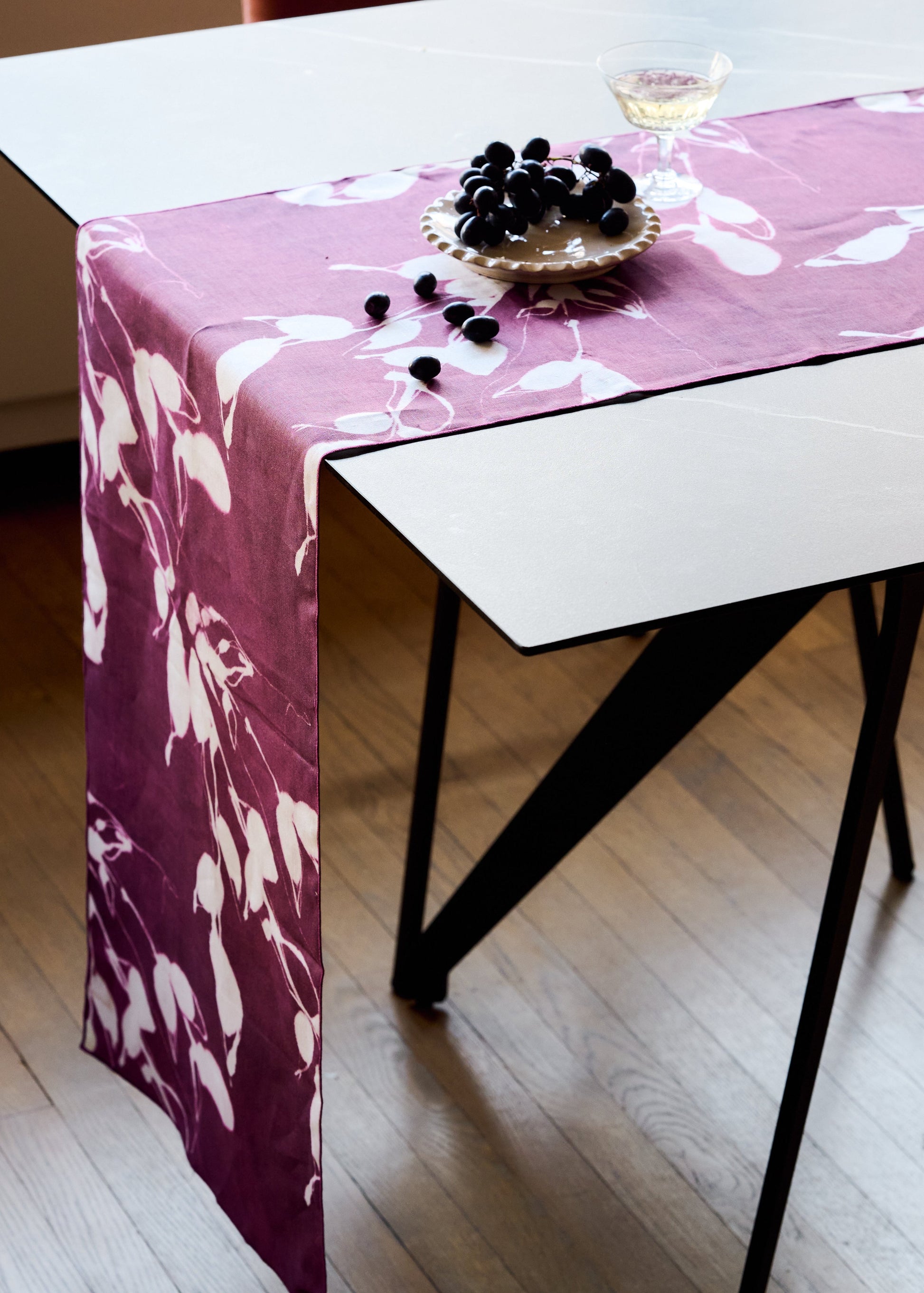 Porto Print Aubergine linen table runner 16x90 with hand-painted cascading floral pattern in deep aubergine - Goldie Home