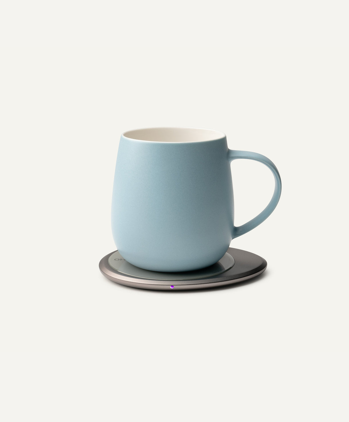 Ui 3 Self-Heating Ceramic Mug 12 fl oz / 355 mL in Moonmist Blue on Ohom Charging Pad 3