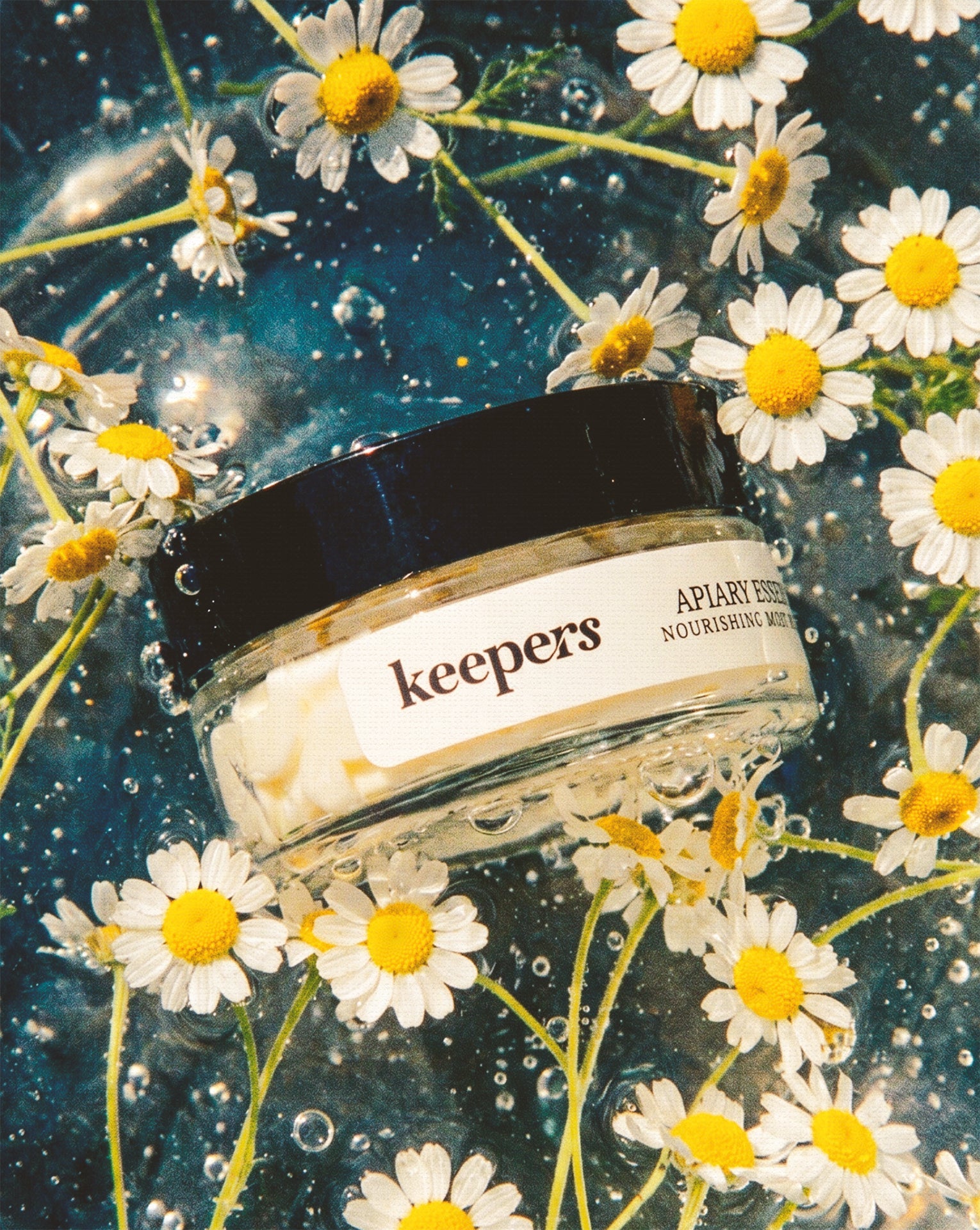 Apiary Essence body butter jar with daisies