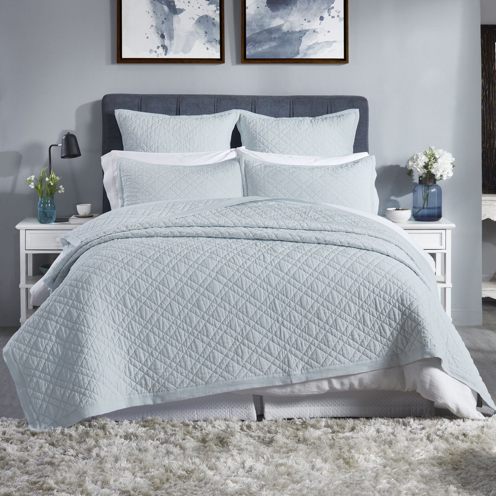 CL-255-11096_1|Serene light blue quilted coverlet dressing a modern bedroom, featuring a subtle diamond pattern for stylish comfort.