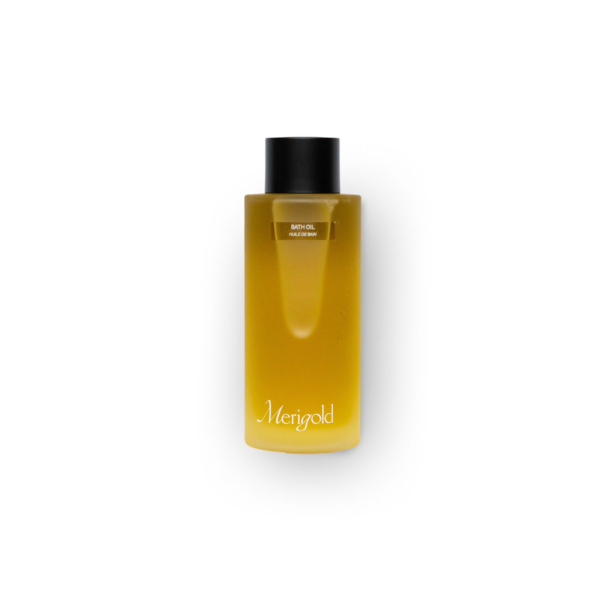 Merigold Bath Oil in frosted clear glass bottle with black cap – nourishing, moisturizing body treatment for dry or sensitive skin, used for self-care and ritual bathing.