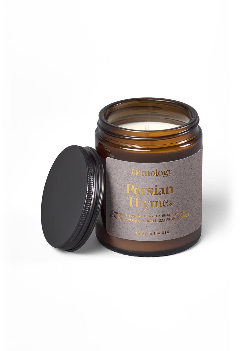Osmology Persian Thyme jar candle with open lid on yellow-cream background