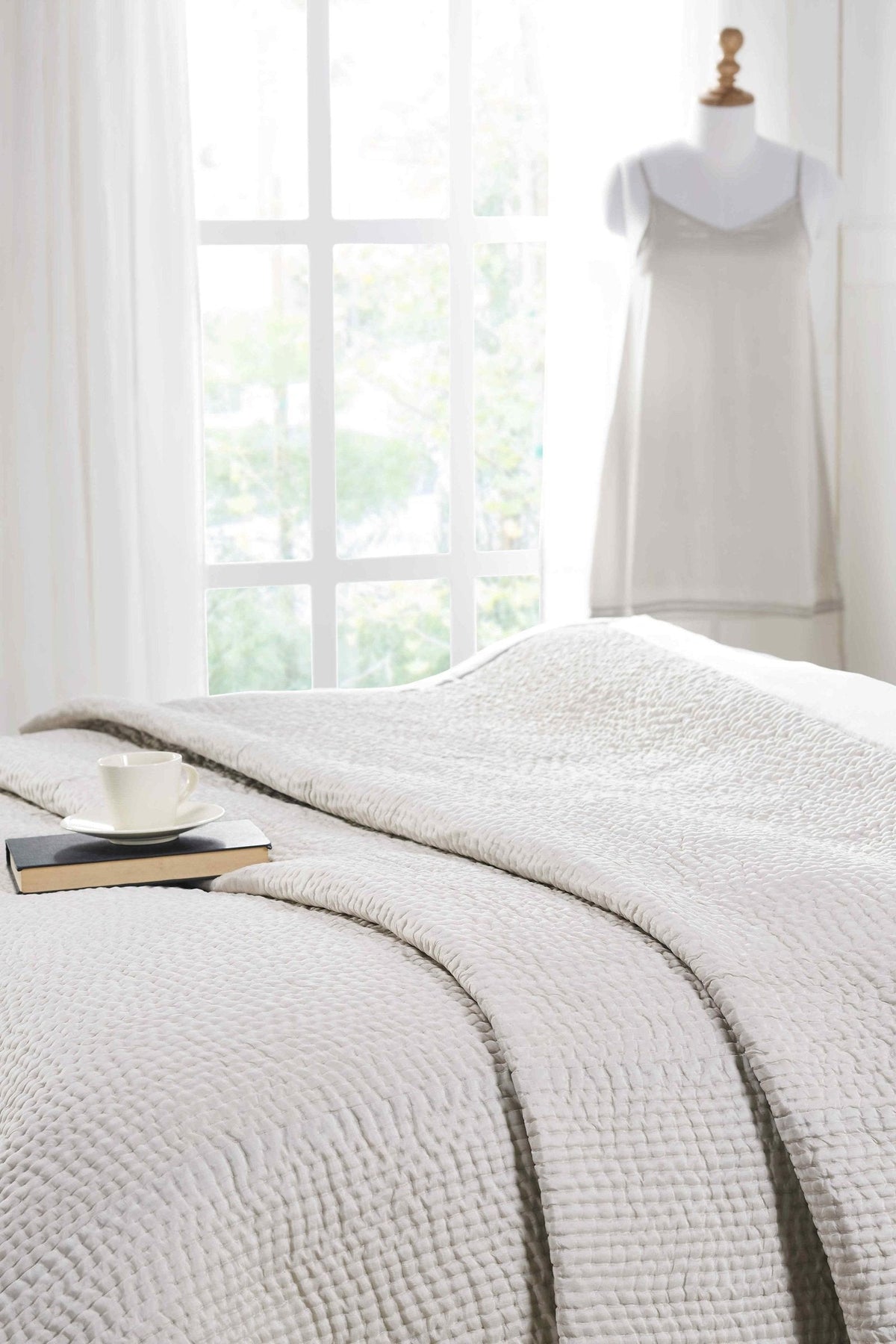 CL-197-11096_2|Elegant light grey quilted coverlet with a textured waffle pattern, enhancing a bright bedroom with relaxed charm.