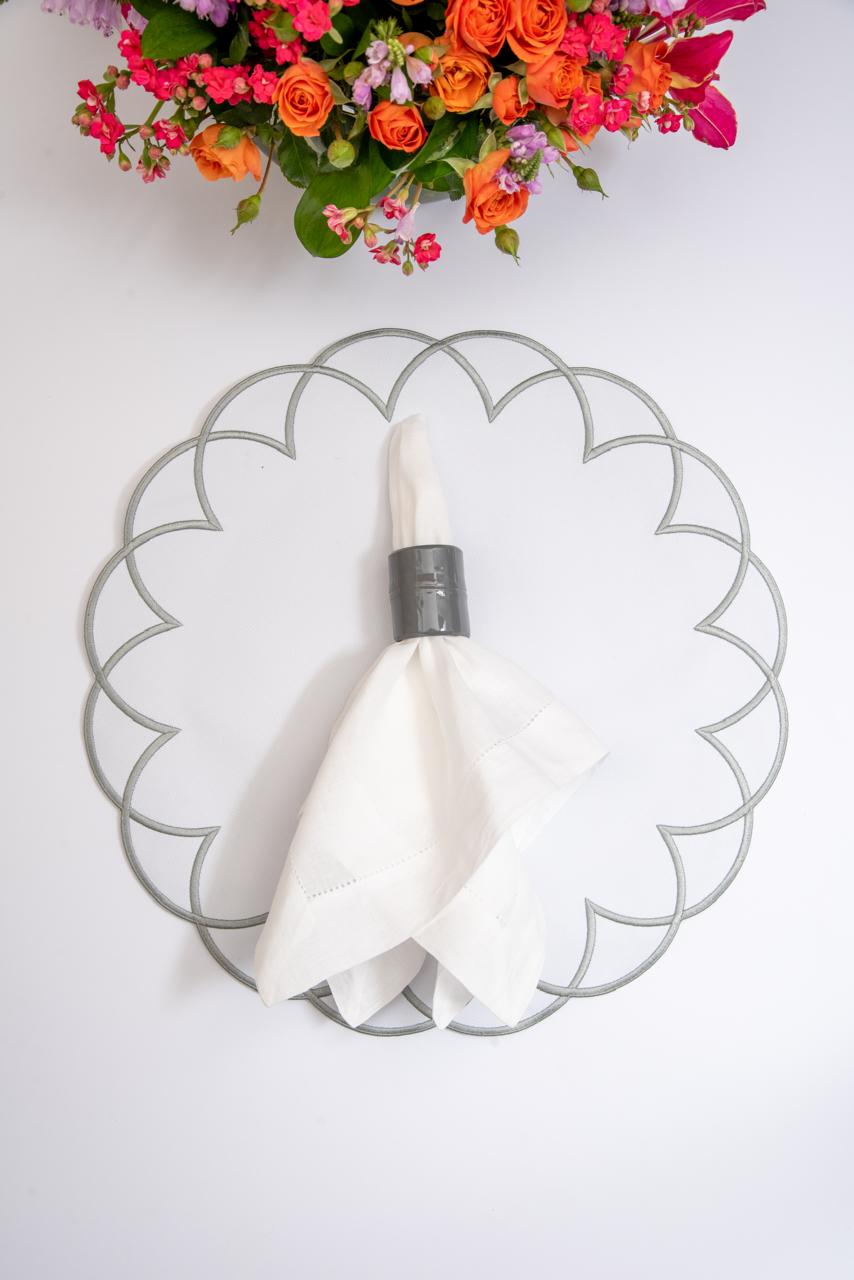 Arc impermeable placemat with embroidered border in white with gray stitching by Talah Home — spill-proof Brazilian table decor