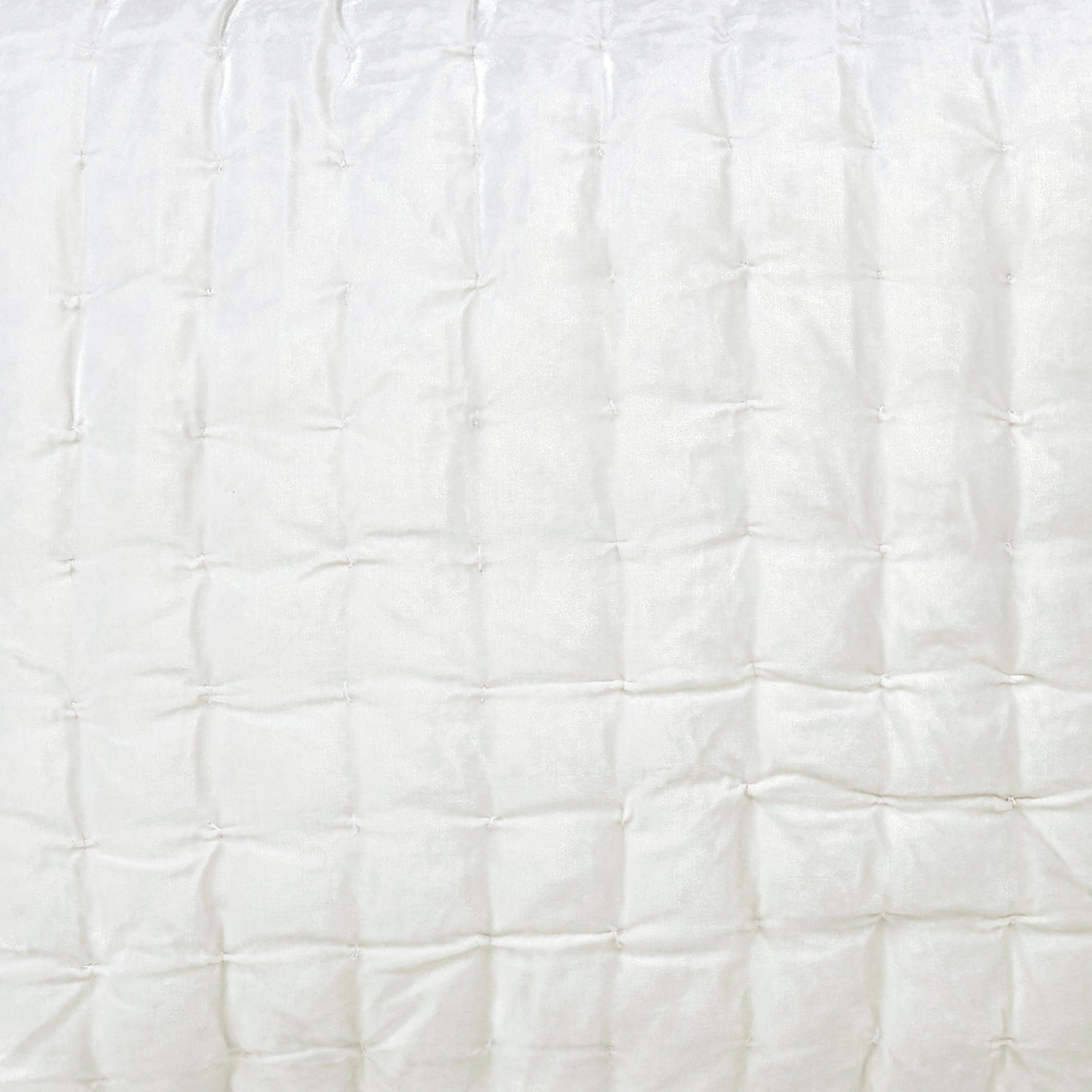 SS-311-2026-LOT1_2|Close-up of pristine white quilted bedding, featuring a subtle square stitch pattern. Clean, modern, inviting texture.