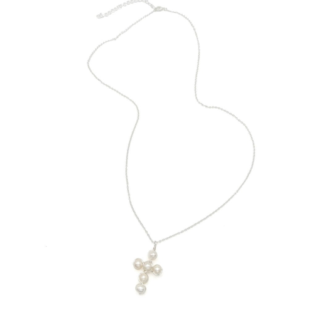 Pearl cross silver jewelry modeled