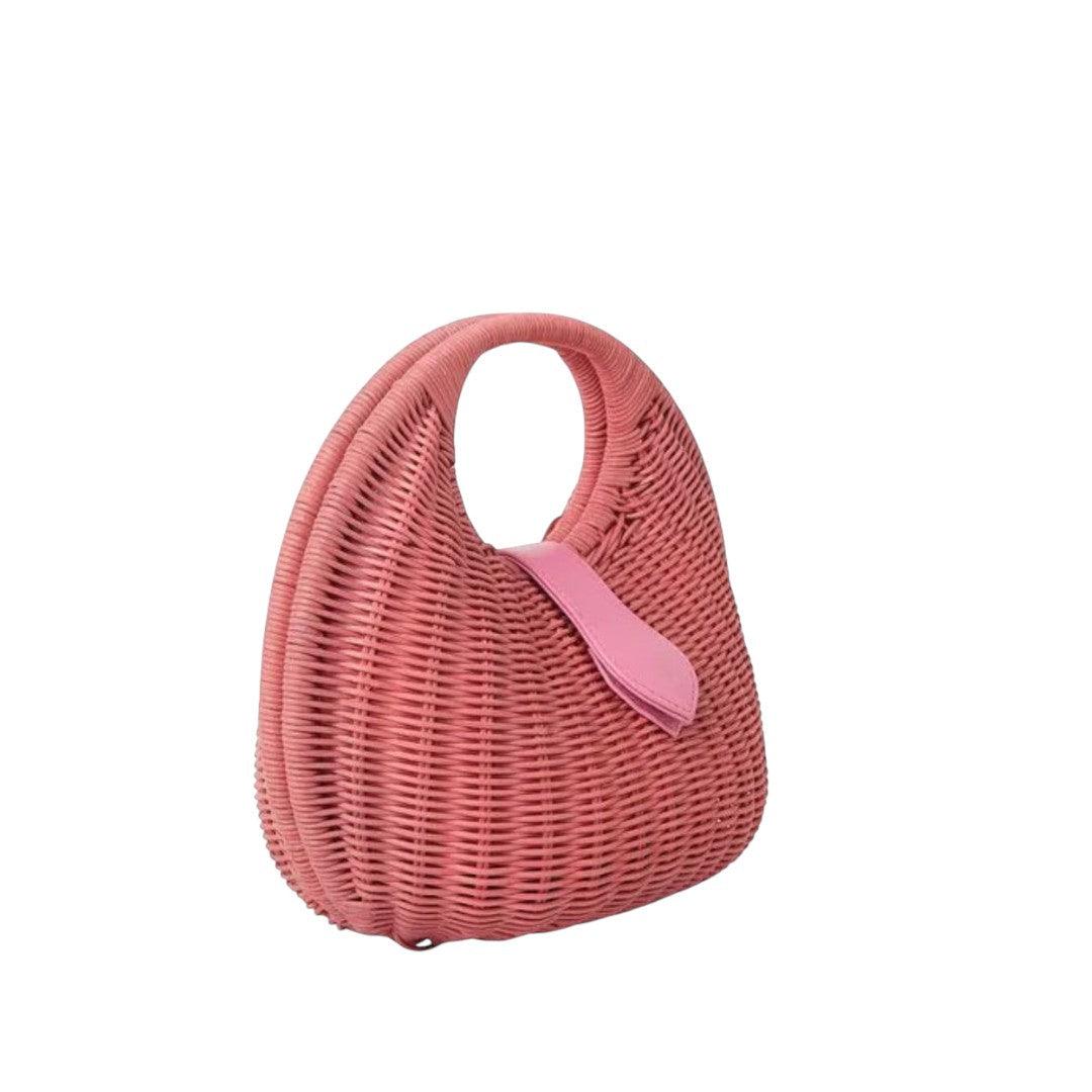 Shop Sarah Stewart Matilda pink wicker handbag with leather strap detail. A modern, relaxed luxury accessory.