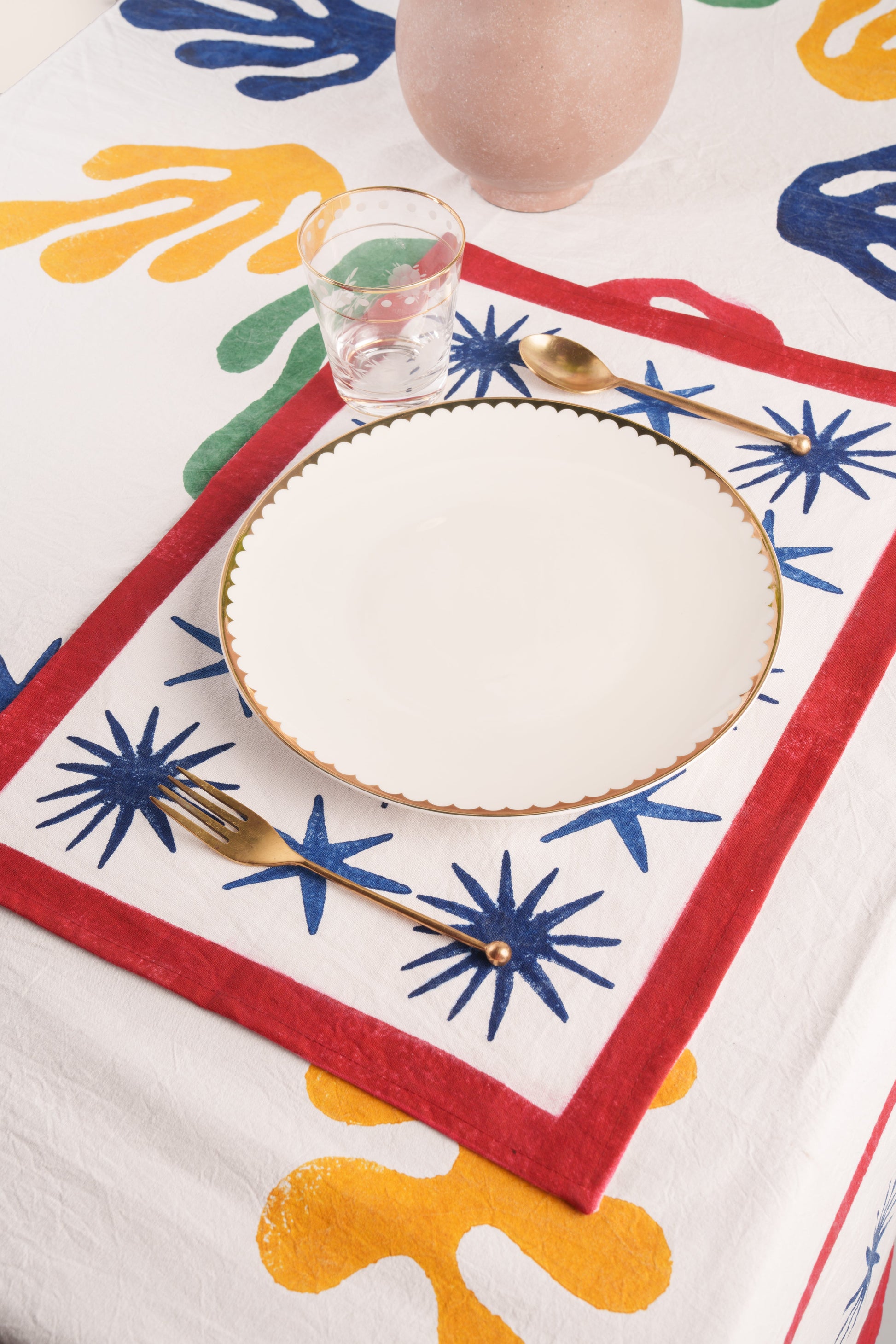 Inner Child Celestial Matisse blockprint placemat with blue star patterns in dining setting