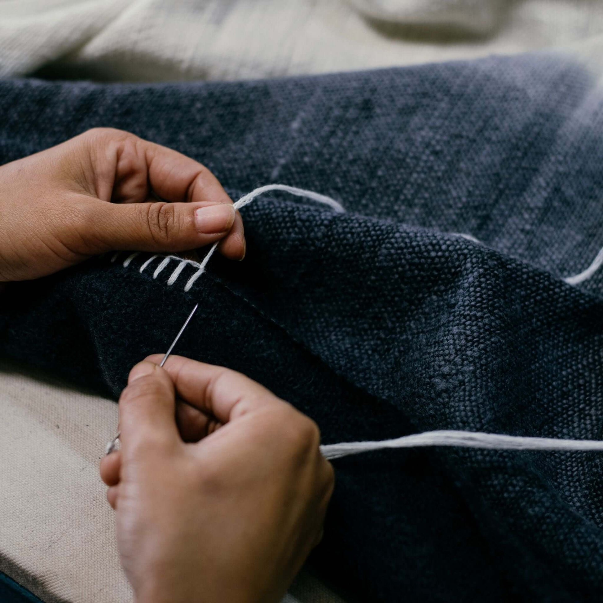 Creating the Ink Black White Ombre Textured Throw In Hand Spun Merino And Hand Stitched Hem.
