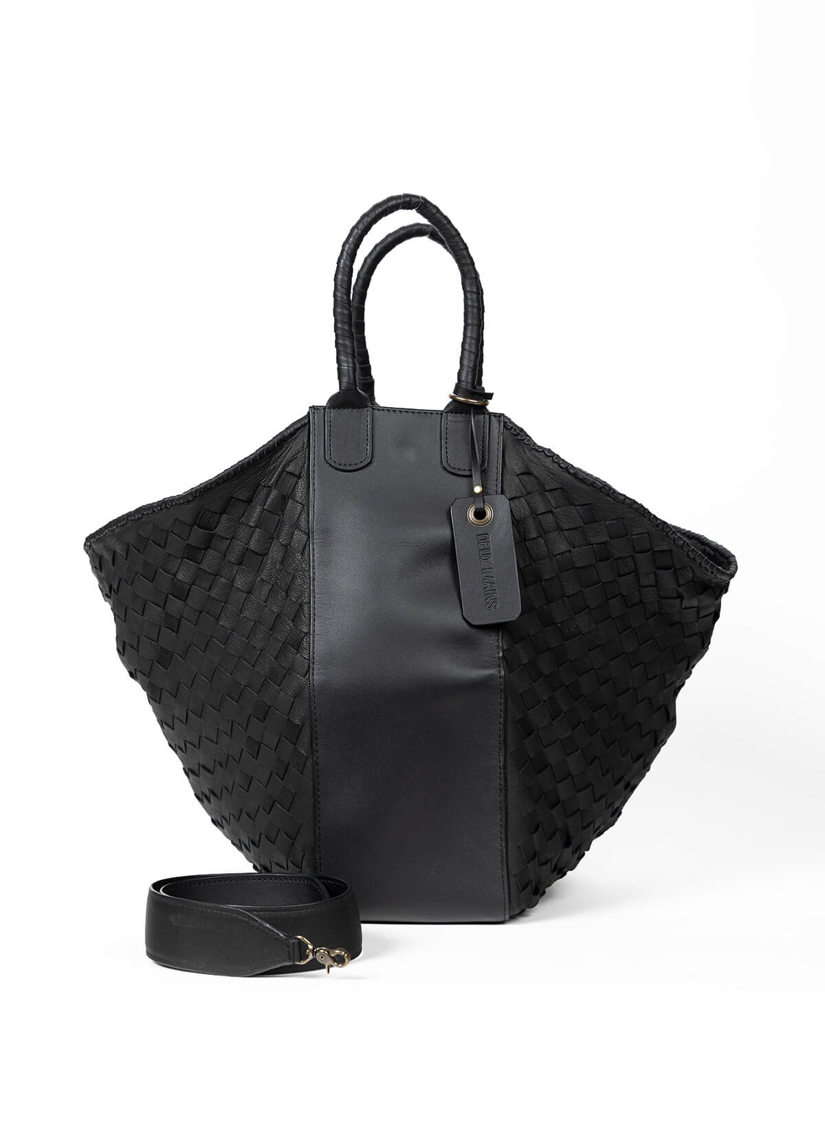 Model leaning back holding the all day tote in black.