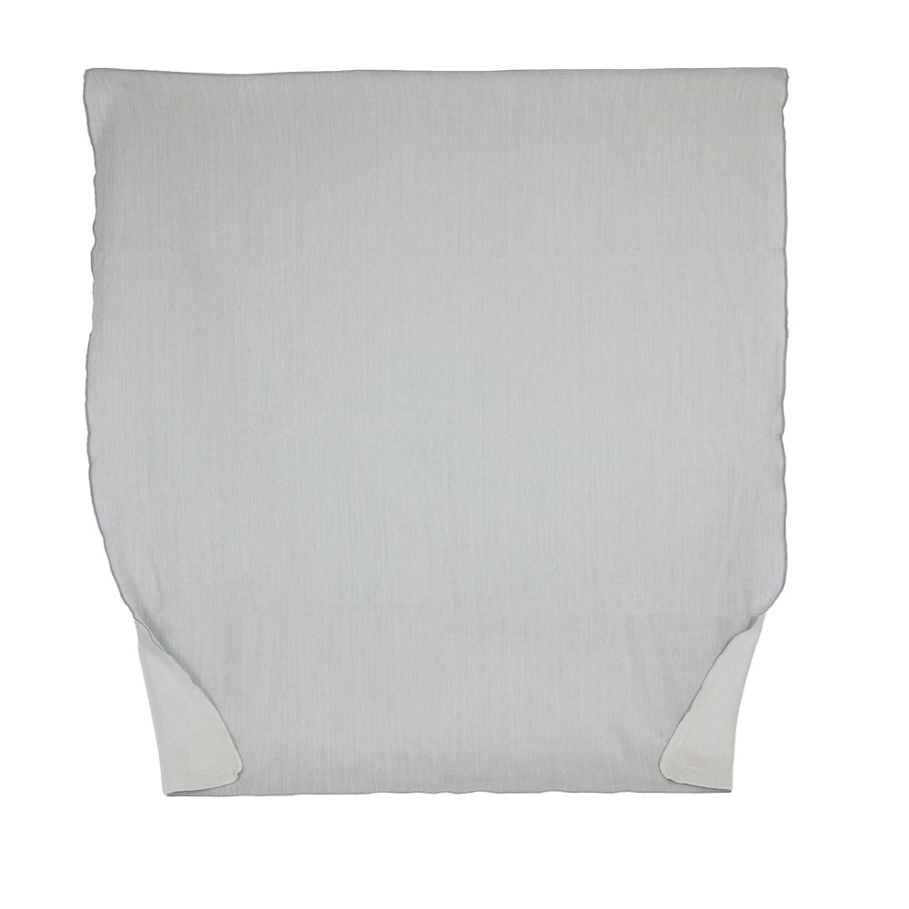 A reversible glacier gray and white throw blanket made from alpaca yarn, displayed flat.