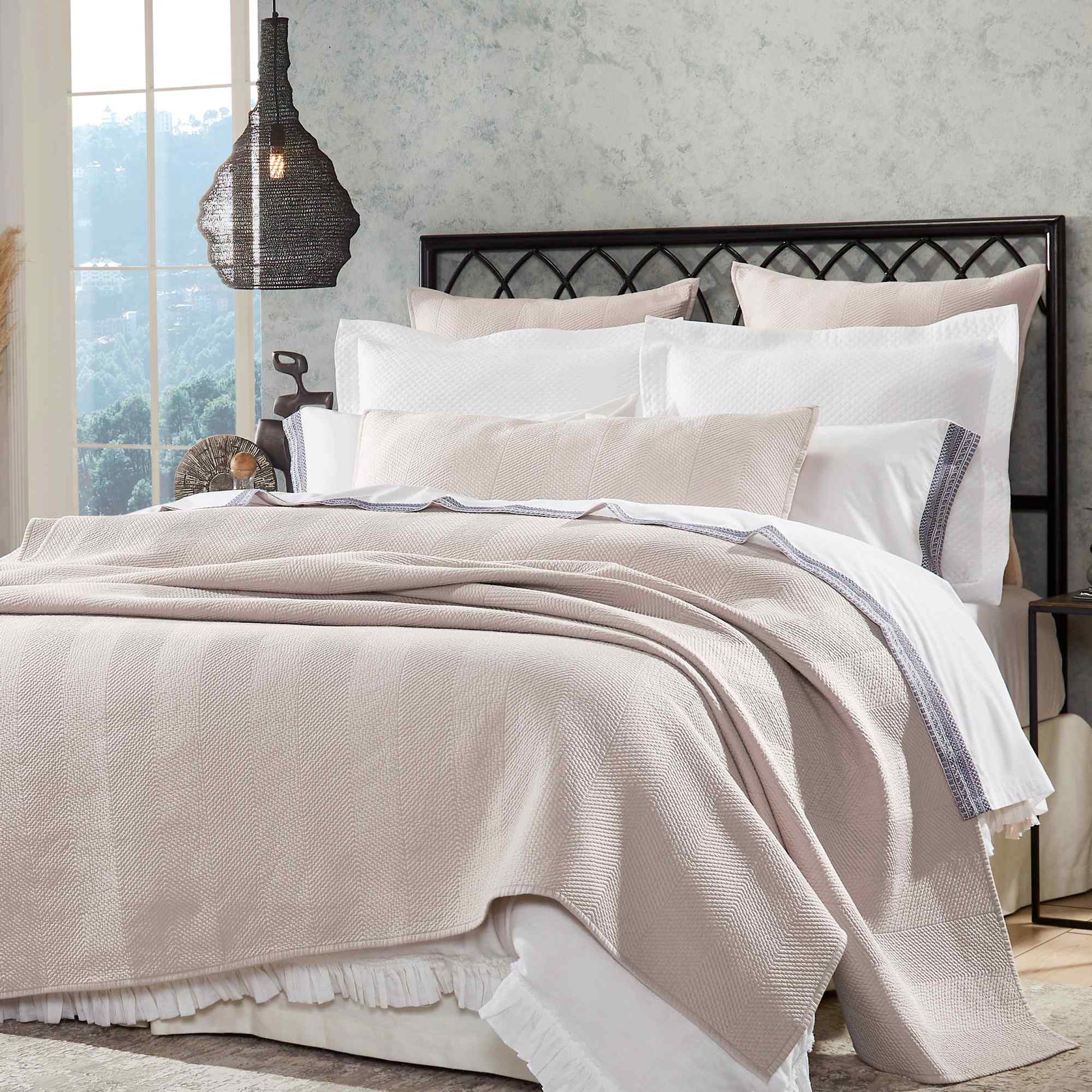 CL-171-11096-LOT1A_2|Stylish beige herringbone patterned coverlet on a modern bed, enhancing bedroom comfort and aesthetic appeal.