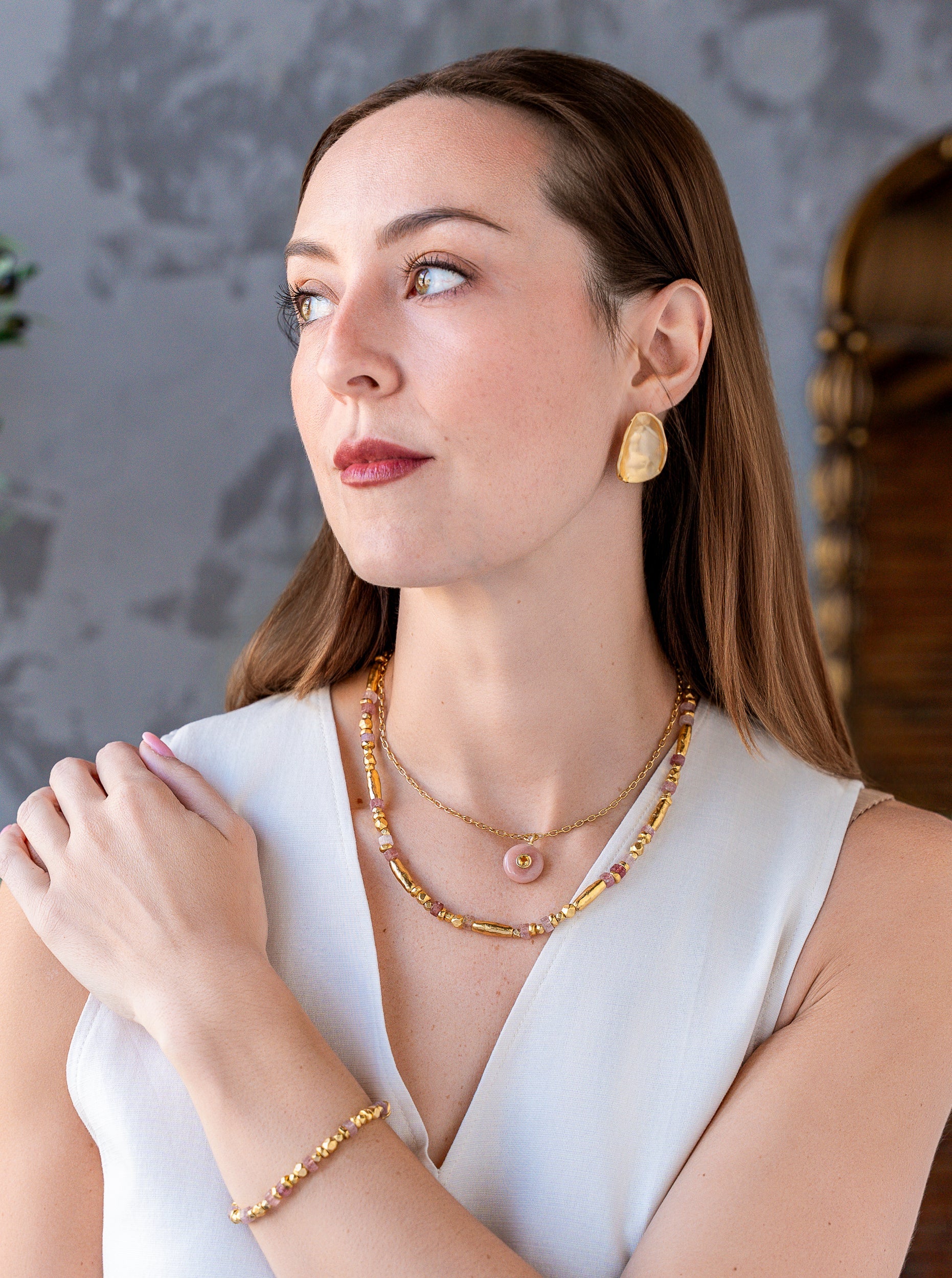 Necklace with pink strawberry quartz beads and organic gold-tone beads in an alternating organic pattern.