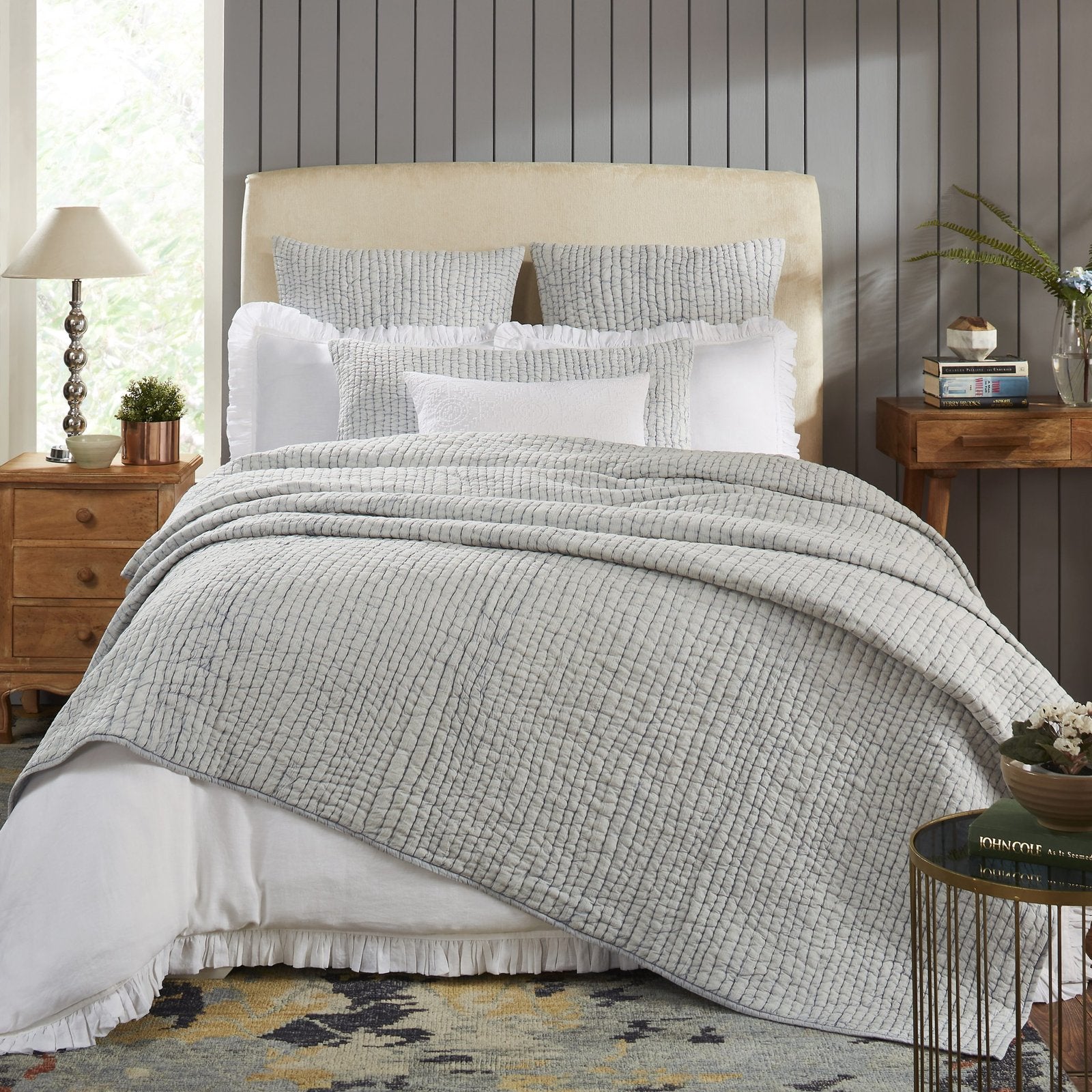 QT-316-11096_1|Serene light blue striped quilted bed quilt drapes gracefully over a stylish bed, enhancing a peaceful bedroom aesthetic.