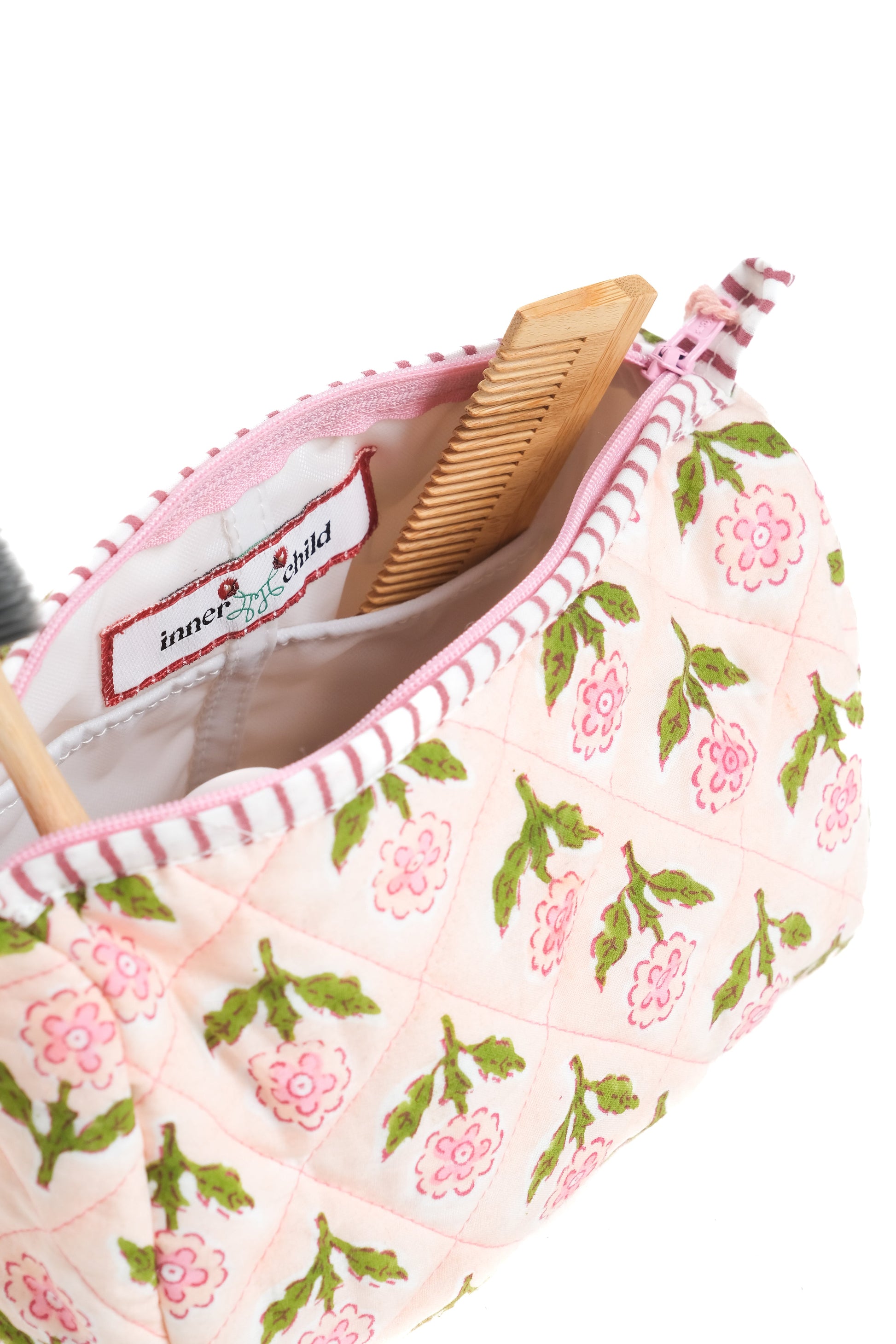 Pink blockprint makeup bag interior showing 'Inner Child' label