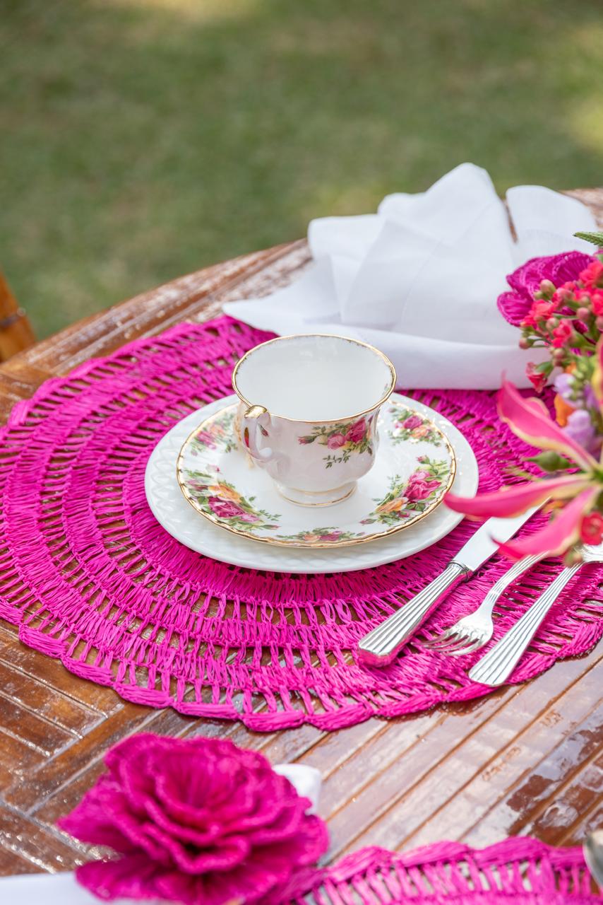 Buriti straw placemat handwoven from natural Brazilian palm fiber in pink by Talah Home