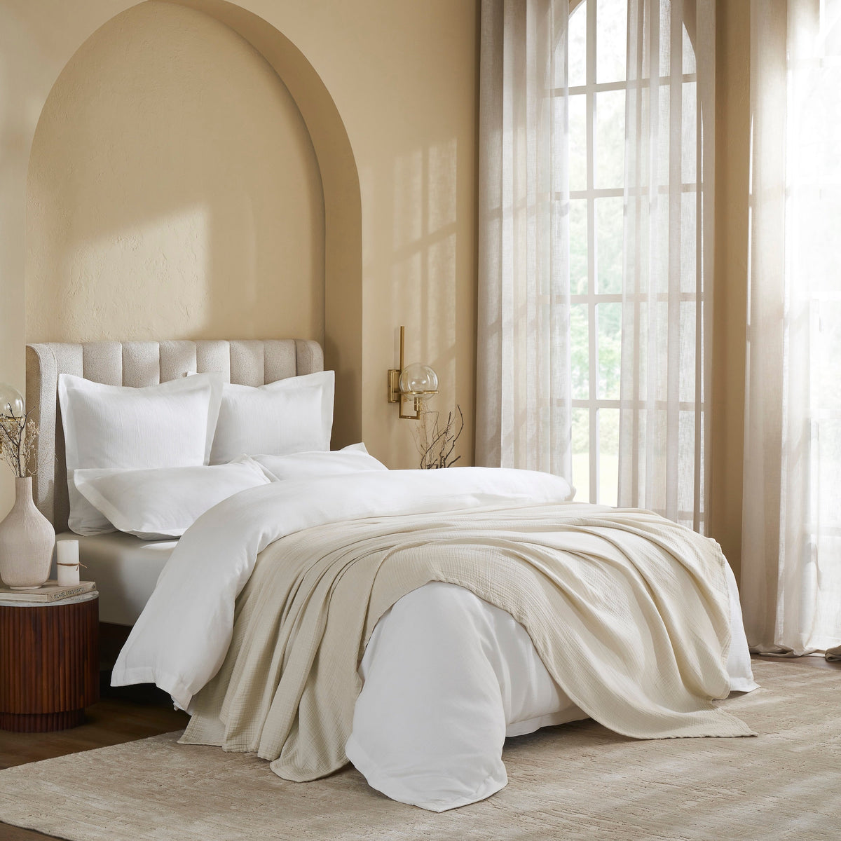 BL-862-9496_3|Luxurious light beige cotton blanket draped on a queen bed, offering breathable comfort and elegant texture. Ideal for layering.