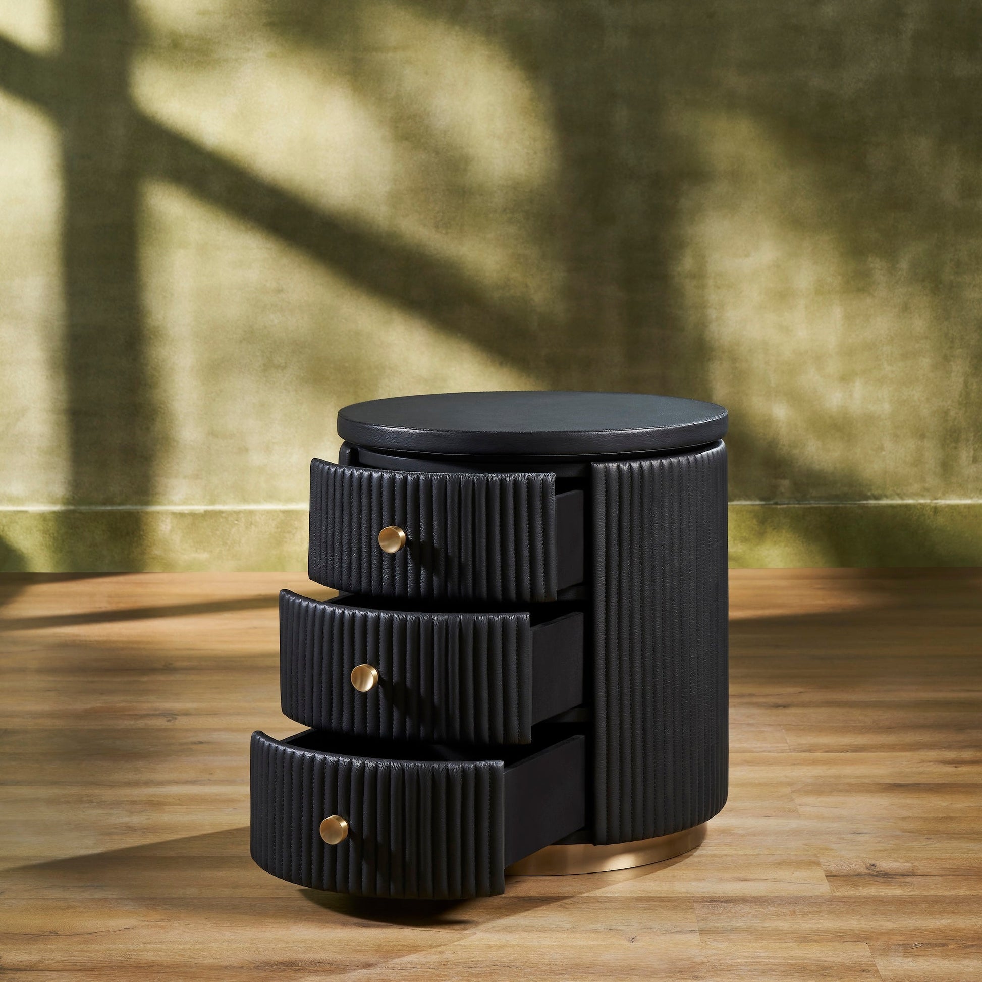 FN-5213-202022_3|Black fluted leather round nightstand with open drawers, revealing ample storage for luxury leather bedroom furniture.