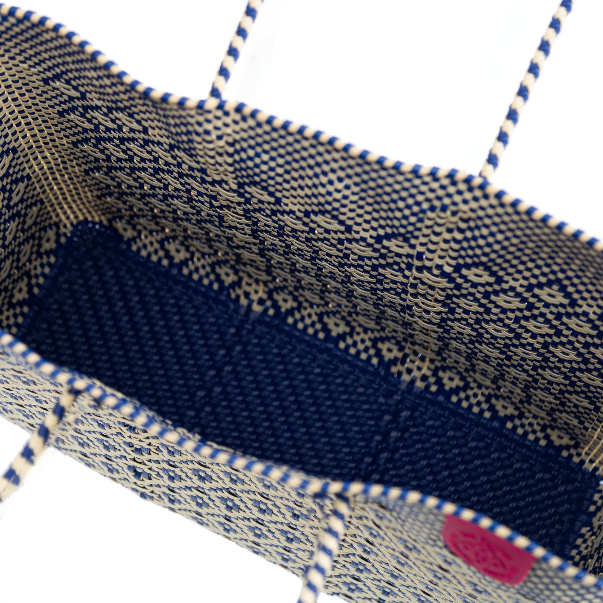 inside look of Tin Marin super tote in mixte Design, A beige and blue rhombus oversized tote bag with a shoulder strap.