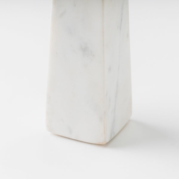 close-up of marble and wood contrast on candleholder
